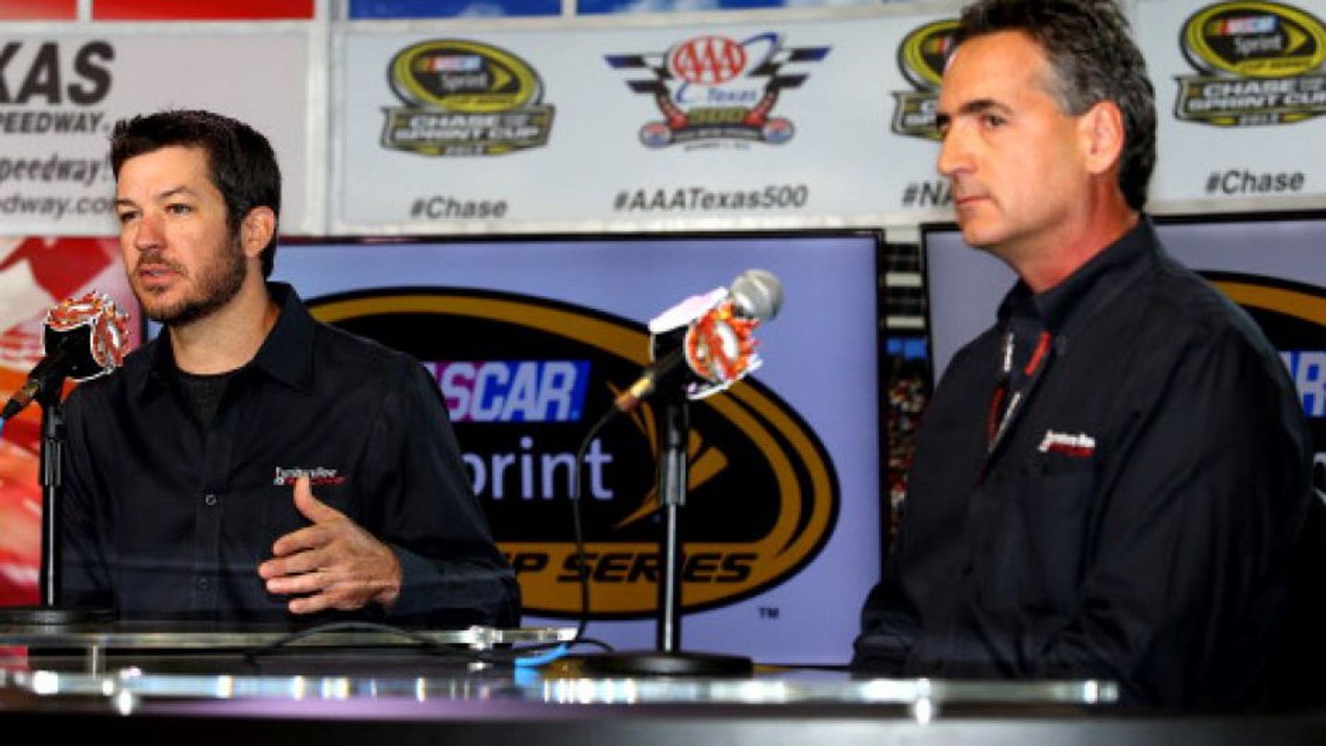 FORT WORTH, TX - NOVEMBER 01: (L-R) Driver Martin Truex is presented as the next driver of the #78 Furniture Row / Denver Mattress Chevrolet by Joe Garone, general manager of Furniture Row Racing, at Texas Motor Speedway on November 1, 2013 in Fort Worth, Texas. (Photo by Todd Warshaw/NASCAR via Getty Images)