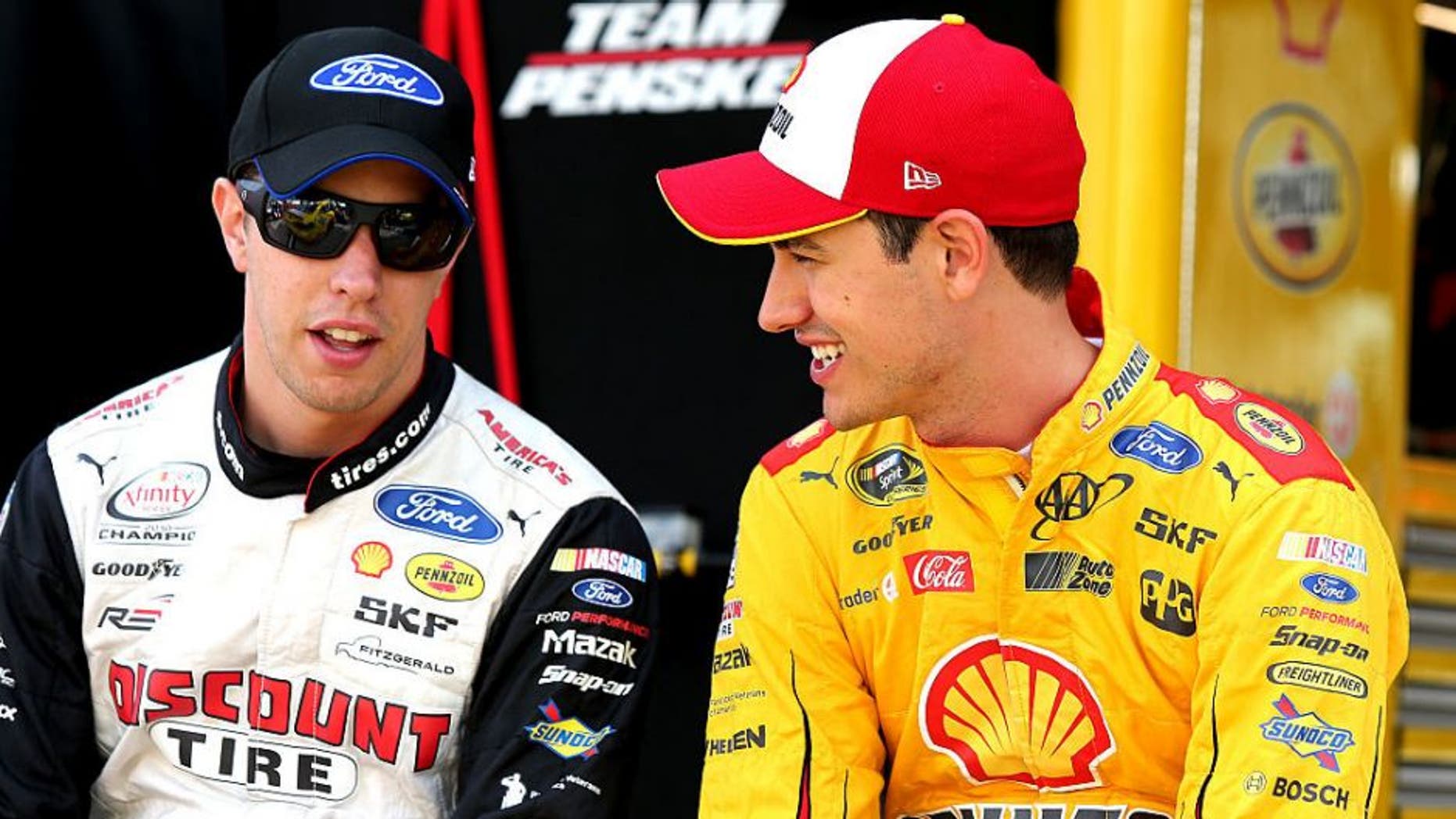 BRISTOL, TN - AUGUST 19: Brad Keselowski, driver of the #2 Autotrader Ford, talks to Joey Logano, driver of the #22 Shell Pennzoil Ford, on the grid during qualifying for the NASCAR Sprint Cup Series Bass Pro Shops NRA Night Race at Bristol Motor Speedway on August 19, 2016 in Bristol, Tennessee. (Photo by Jerry Markland/Getty Images)