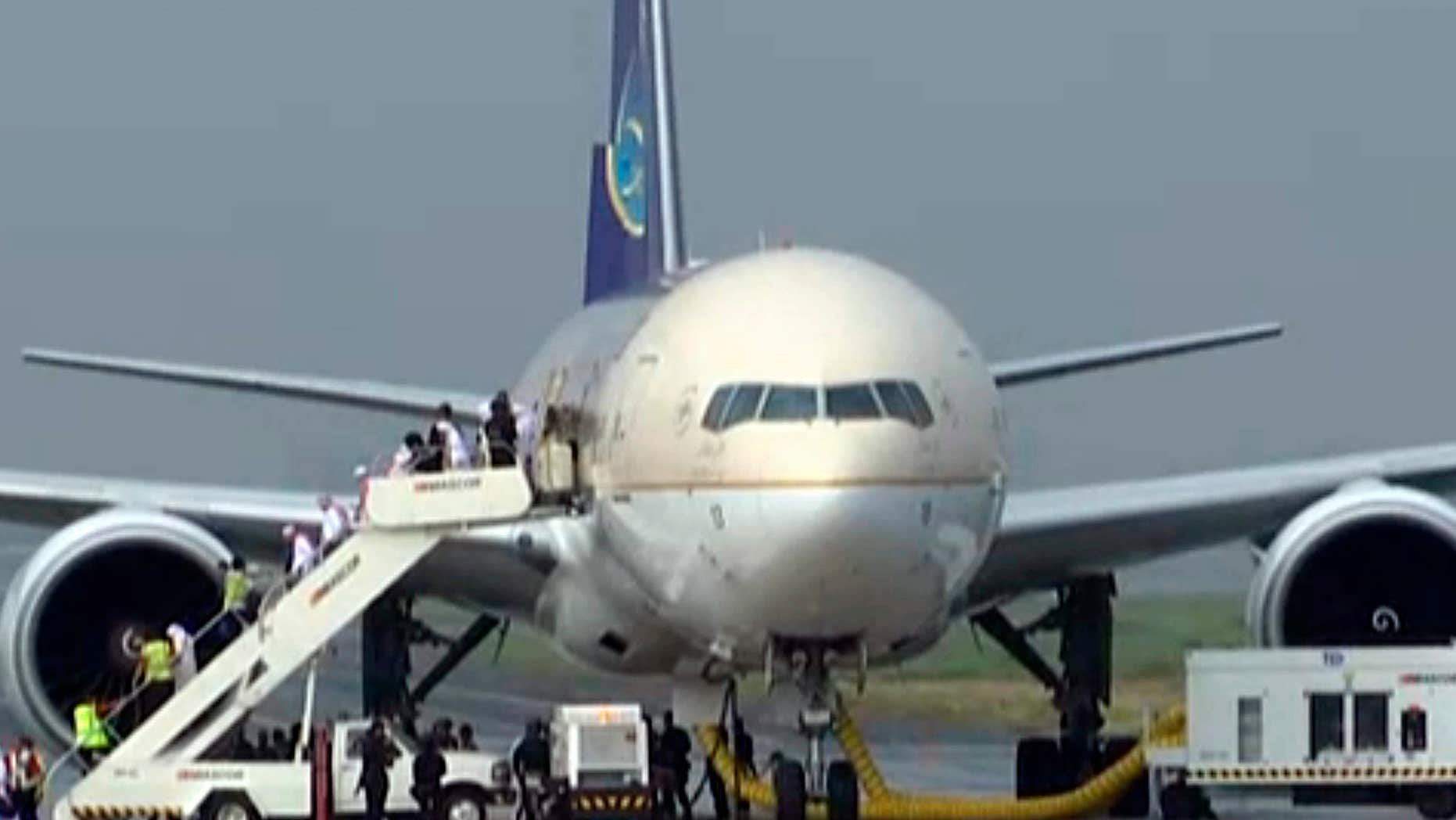 Sept. 20, 2016: In this image made from video, people disembark a Saudi Arabian Airlines plane from Jeddah as it is parked at the airport in Manila, the Philippines.