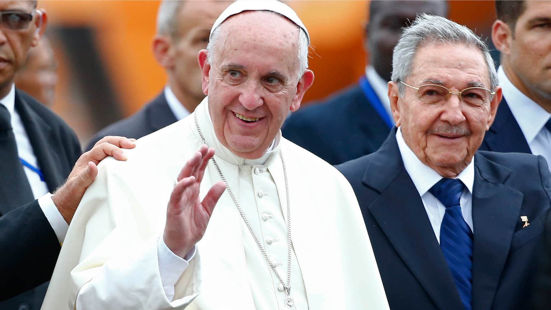 Sept. 19, 2015: Pope Francis waves next to Cuba's President Raul Castro during his arrival ceremony at the airport in Havana, Cuba.