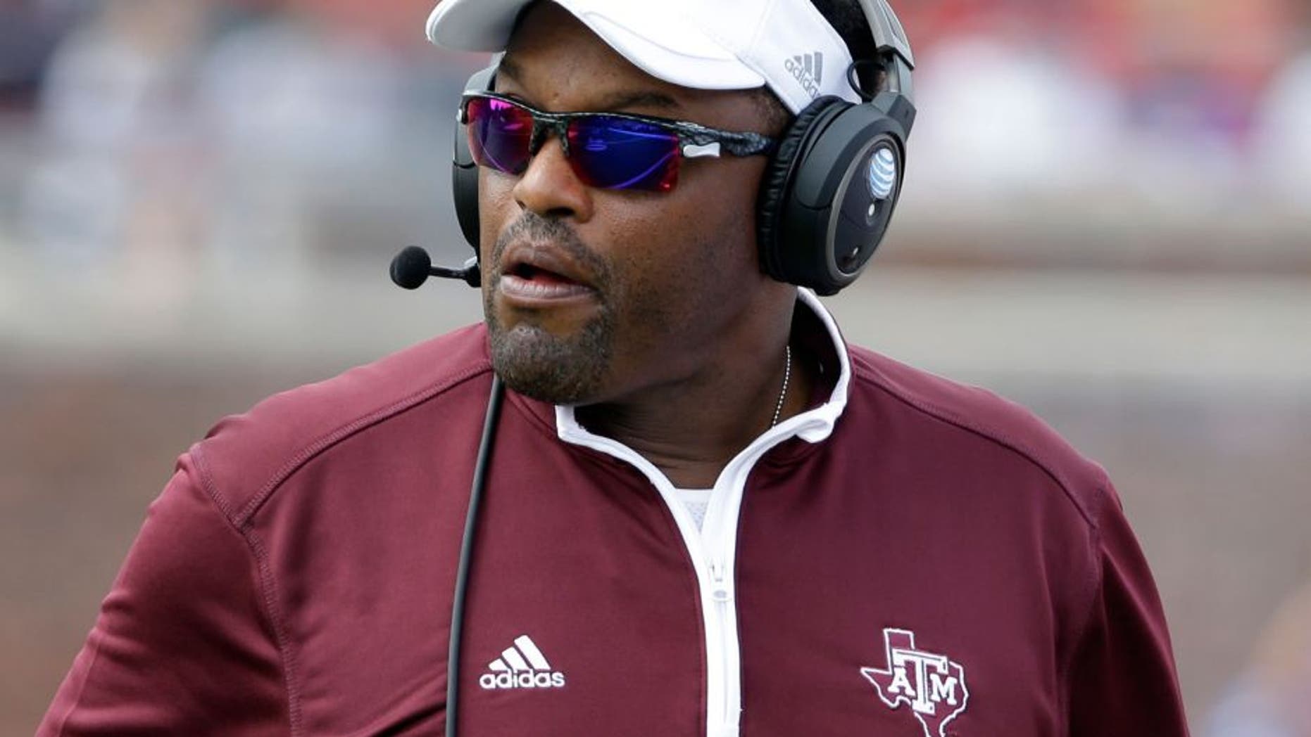 Texas A&M head coach Kevin Sumlin watches a play in the first half of an NCAA college football game against SMU, Saturday, Sept. 20, 2014, in Dallas. (AP Photo/Tony Gutierrez)