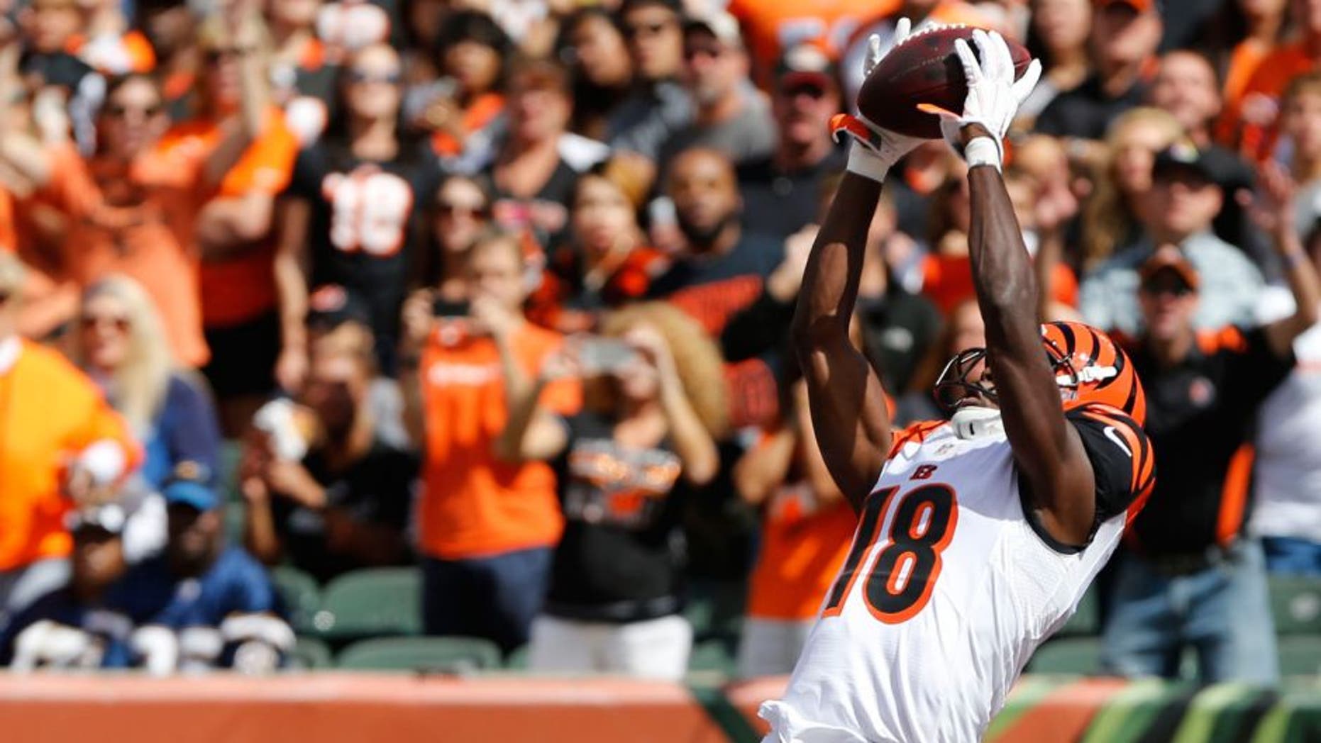 Sep 20, 2015; Cincinnati, OH, USA; Cincinnati Bengals wide receiver A.J. Green (18) catches a pass for a touchdown over San Diego Chargers cornerback Brandon Flowers (24) in the first half at Paul Brown Stadium. Mandatory Credit: Aaron Doster-USA TODAY Sports