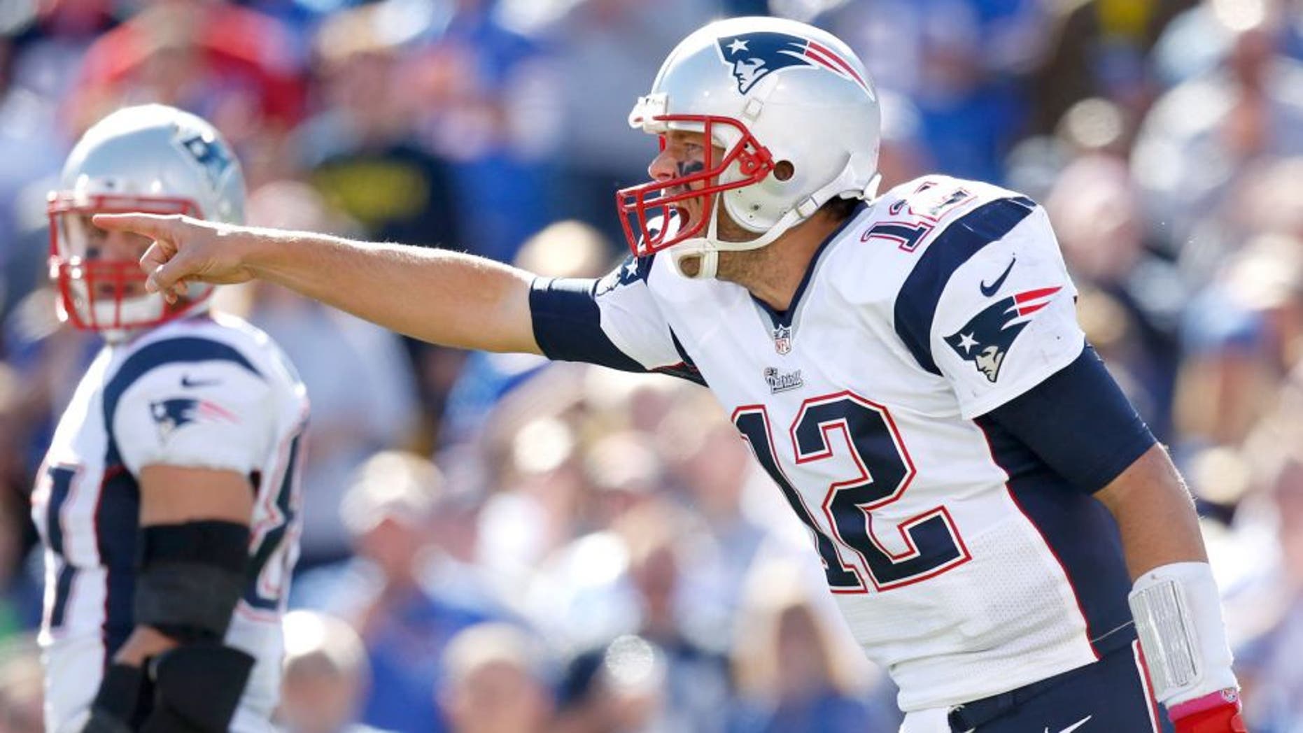 Oct 12, 2014; Orchard Park, NY, USA; New England Patriots quarterback Tom Brady (12) calls an audible during the game against the Buffalo Bills at Ralph Wilson Stadium. Mandatory Credit: Kevin Hoffman-USA TODAY Sports
