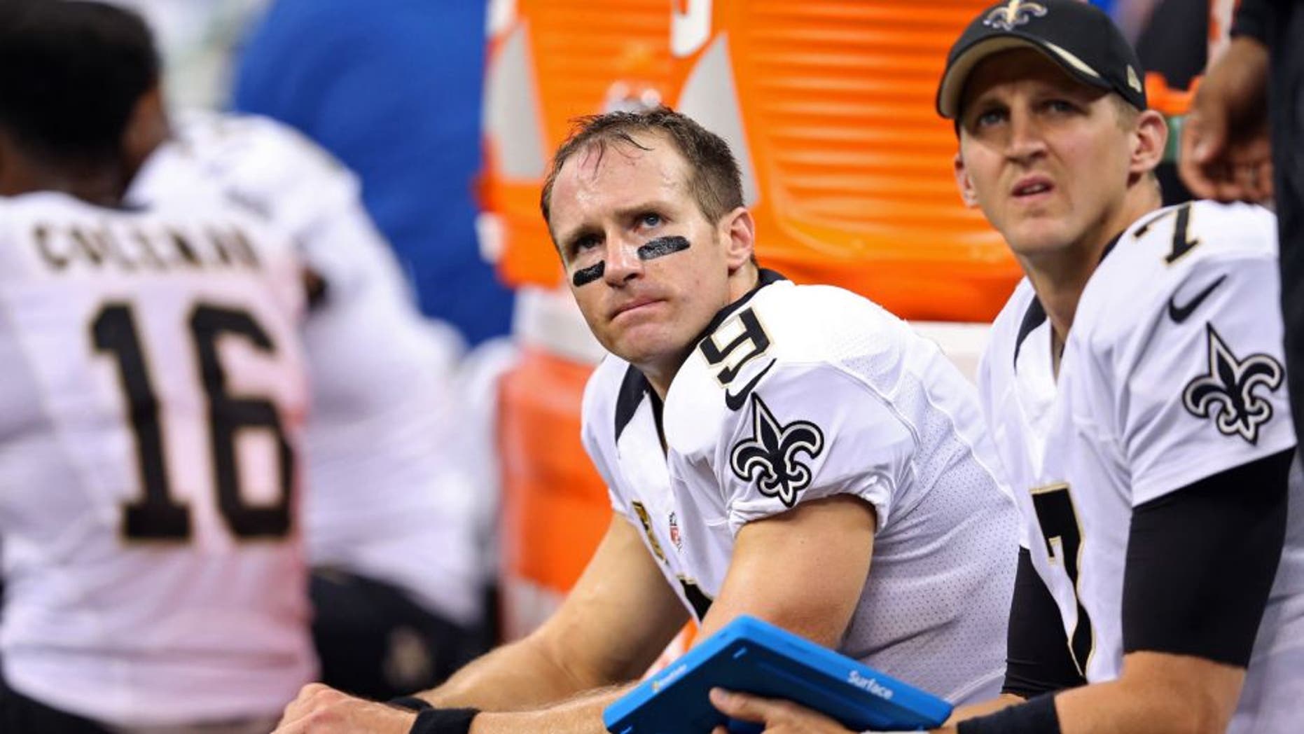 Sep 20, 2015; New Orleans, LA, USA; New Orleans Saints quarterbacks Drew Brees (9) and Luke McCown (7) on the bench in the second half against the Tampa Bay Buccaneers at the Mercedes-Benz Superdome. The Tampa Bay Buccaneers won, 23-19. Mandatory Credit: Chuck Cook-USA TODAY Sports