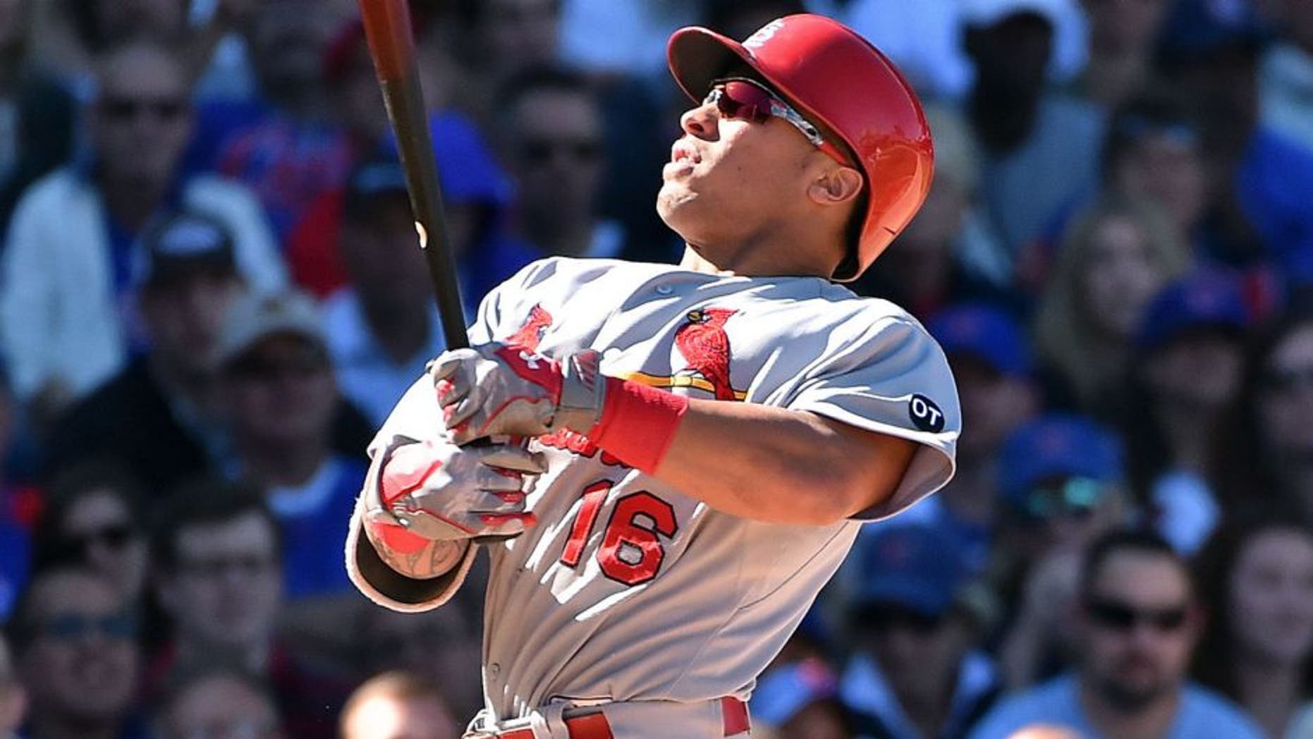 Sep 19, 2015; Chicago, IL, USA; St. Louis Cardinals second baseman Kolten Wong (16) is hit by the pitch of Chicago Cubs relief pitcher Fernando Rodney (not pictured) at Wrigley Field. Mandatory Credit: Jasen Vinlove-USA TODAY Sports