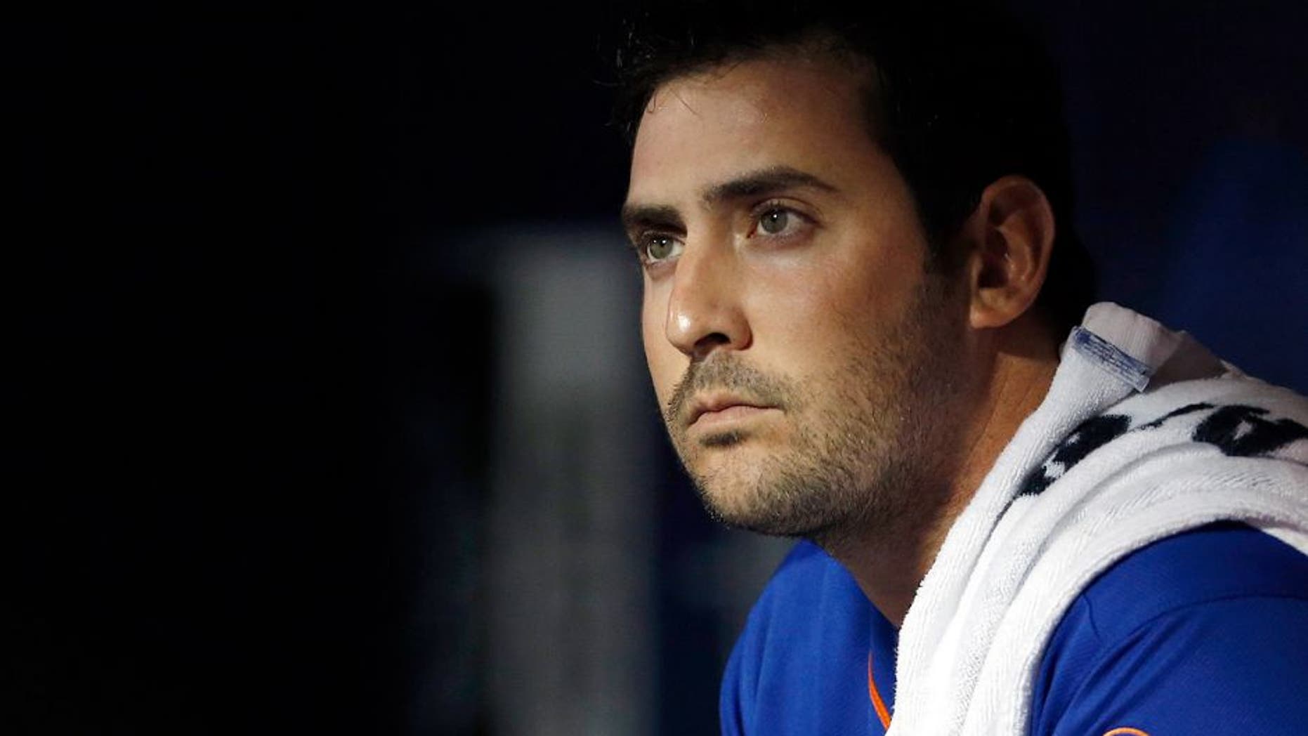 NEW YORK, NY - SEPTEMBER 20: Matt Harvey #33 of the New York Mets looks on from the dugout during the second inning against the New York Yankees at Citi Field on September 20, 2015 in the Queens borough of New York City. (Photo by Adam Hunger/Getty Images)