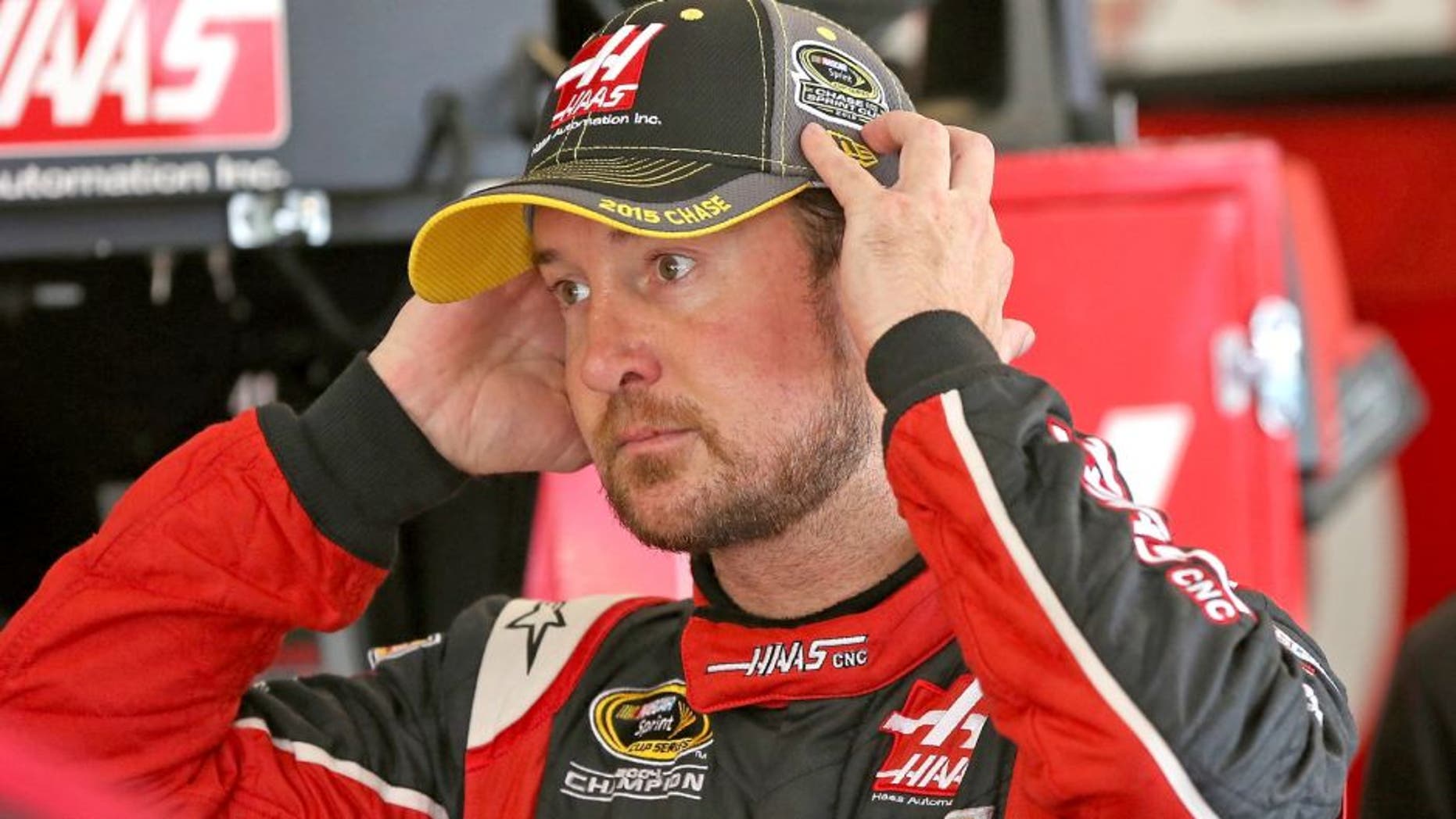 JOLIET, IL - SEPTEMBER 19: Kurt Busch, driver of the #41 Haas Automation Chevrolet, stands in the garage area during practice for the NASCAR Sprint Cup Series MyAFibRisk.com 400 at Chicagoland Speedway on September 19, 2015 in Joliet, Illinois. (Photo by Jonathan Daniel/Getty Images)