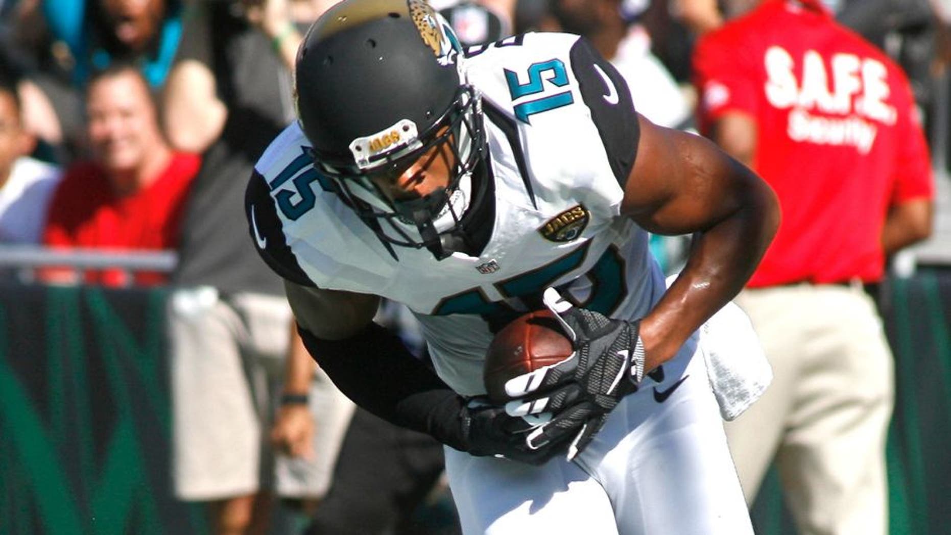 Sep 20, 2015; Jacksonville, FL, USA; Jacksonville Jaguars wide receiver Allen Robinson (15) catches a touchdown pass as Miami Dolphins cornerback Brice McCain (24) cannot defend in the first quarter at EverBank Field. Mandatory Credit: Phil Sears-USA TODAY Sports