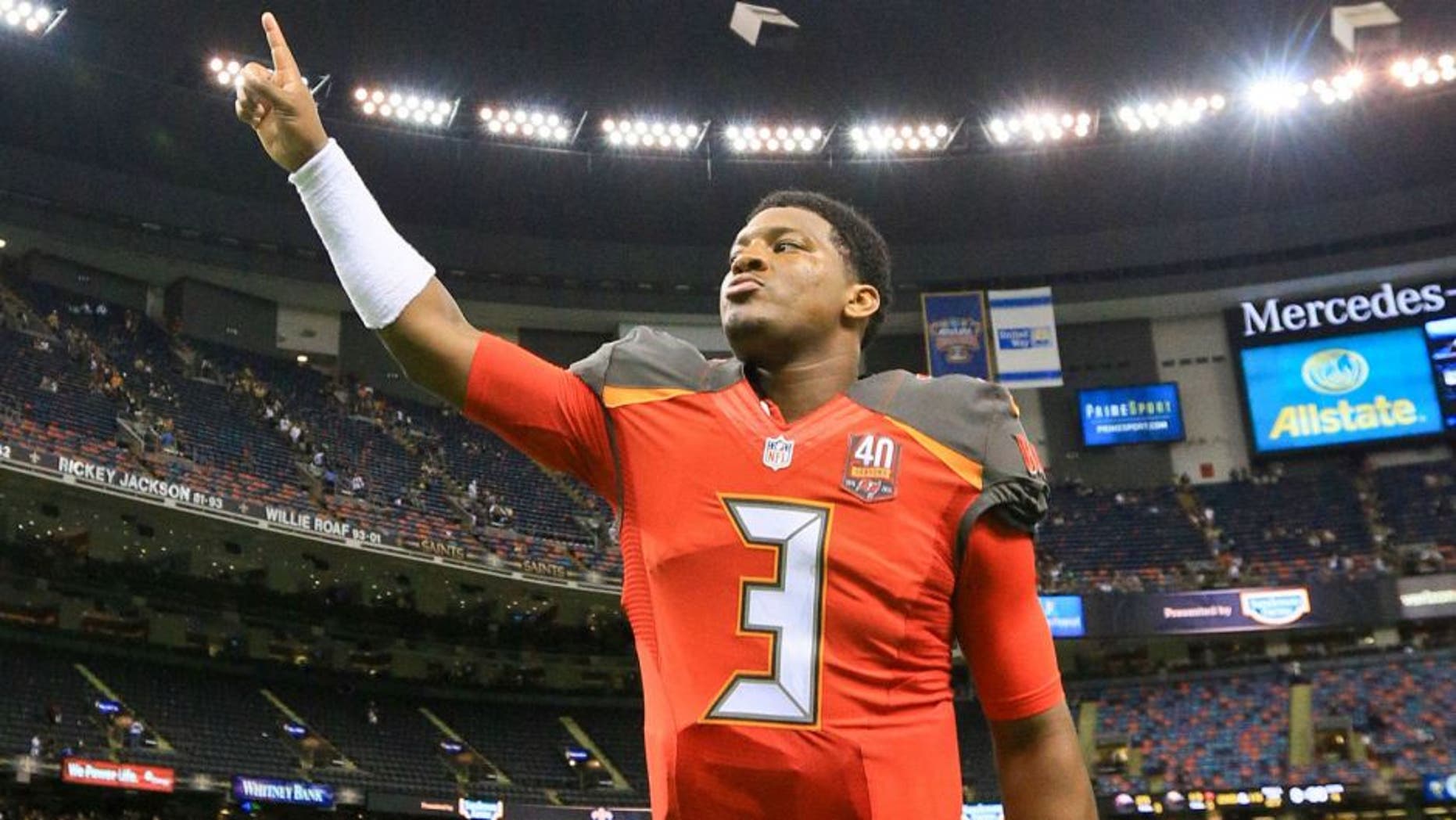 Sep 20, 2015; New Orleans, LA, USA; Tampa Bay Buccaneers quarterback Jameis Winston (3) celebrates as he leaves the field following his first career win in the NFL coming against the New Orleans Saints in a game at the Mercedes-Benz Superdome. The Buccaneers defeated the Saints 26-19. Mandatory Credit: Derick E. Hingle-USA TODAY Sports