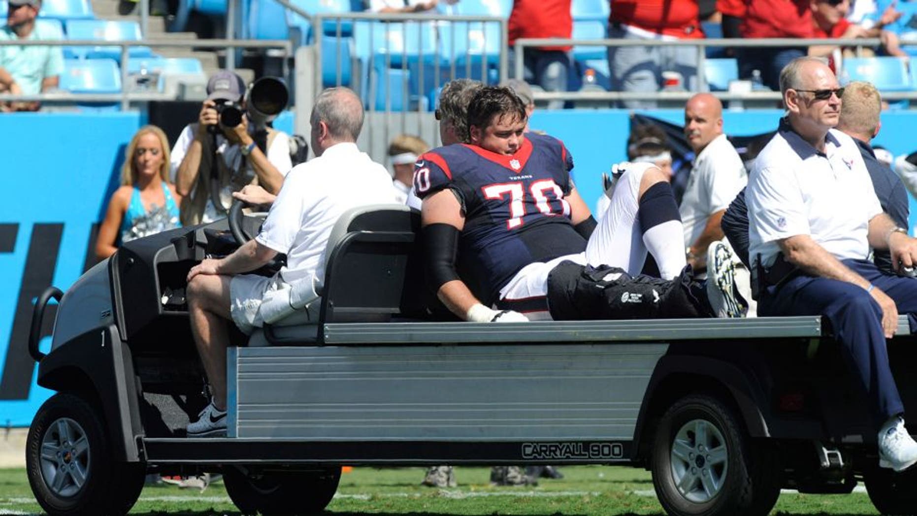 Sep 20, 2015; Charlotte, NC, USA; Houston Texans tackle Jeff Adams (70) is carted off the field after hurting his leg during the first half of the game against the Carolina Panthers at Bank of America Stadium. Mandatory Credit: Sam Sharpe-USA TODAY Sports