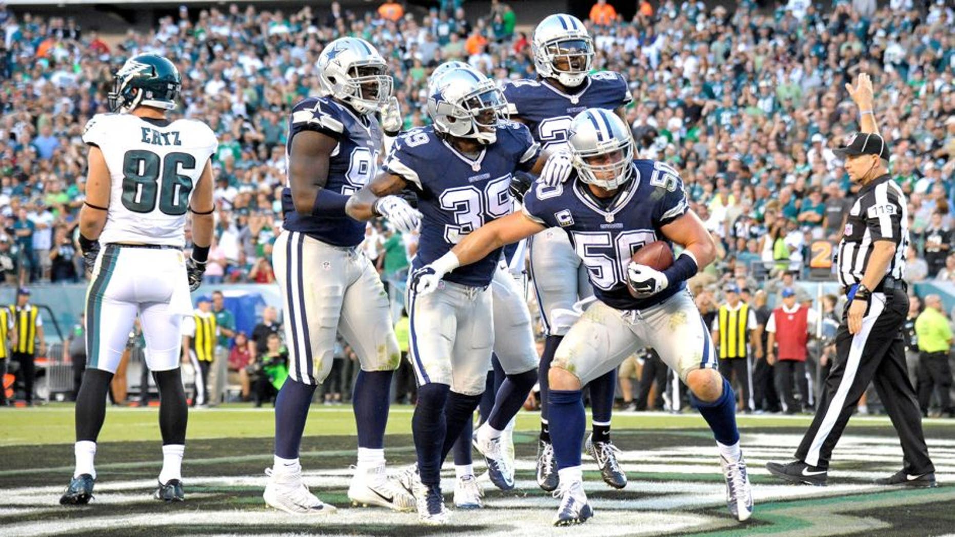 Sep 20, 2015; Philadelphia, PA, USA; Dallas Cowboys outside linebacker Sean Lee (50) celebrates his interception in the end zone intended for Philadelphia Eagles tight end Zach Ertz (86) during the third quarter at Lincoln Financial Field. Mandatory Credit: Eric Hartline-USA TODAY Sports