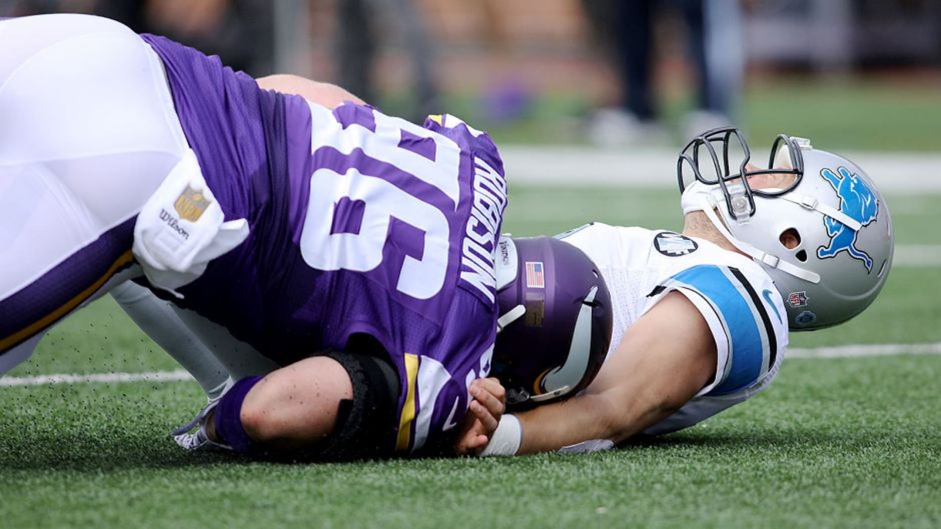 MINNEAPOLIS, MN - SEPTEMBER 20: Brian Robison #96 of the Minnesota Vikings tackles Matthew Stafford #9 of the Detroit Lions in the first quarter at TCF Bank Stadium on September 20, 2015 in Minneapolis, Minnesota. (Photo by Adam Bettcher/Getty Images)