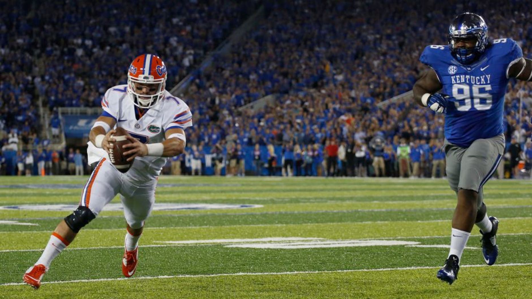 Sep 19, 2015; Lexington, KY, USA; Florida Gators quarterback Will Grier (7) runs for a touchdown against the Kentucky Wildcats in the first quarter at Commonwealth Stadium. Mandatory Credit: Mark Zerof-USA TODAY Sports