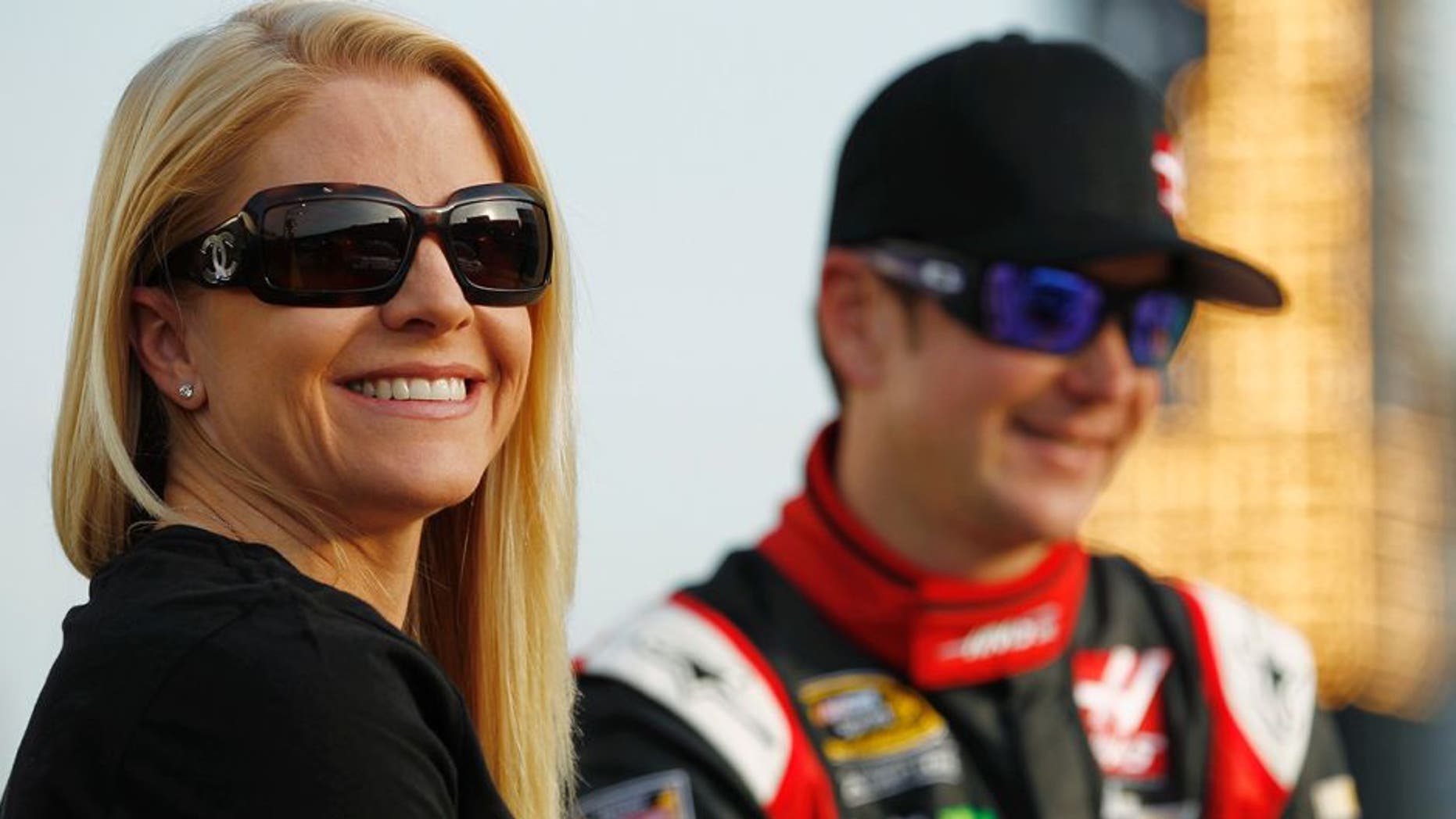 CHARLOTTE, NC - MAY 22: Patricia Driscoll stands on the grid with Kurt Busch, driver of the #41 Haas Automation Made in America Chevrolet, during qualifying for the NASCAR Sprint Cup Series Coca-Cola 600 at Charlotte Motor Speedway on May 22, 2014 in Charlotte, North Carolina. (Photo by Jeff Zelevansky/NASCAR via Getty Images)