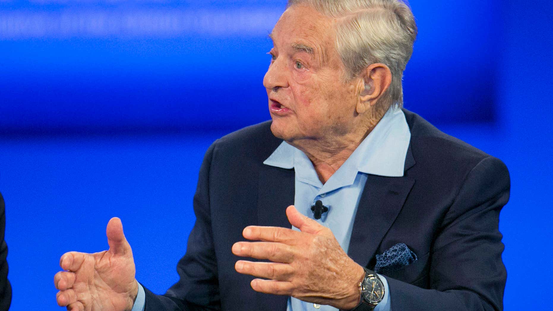 FILE - In this Sept. 27, 2015, file photo, George Soros, chairman of Soros Fund Management, talks during a television interview for CNN at the Clinton Global Initiative in New York.