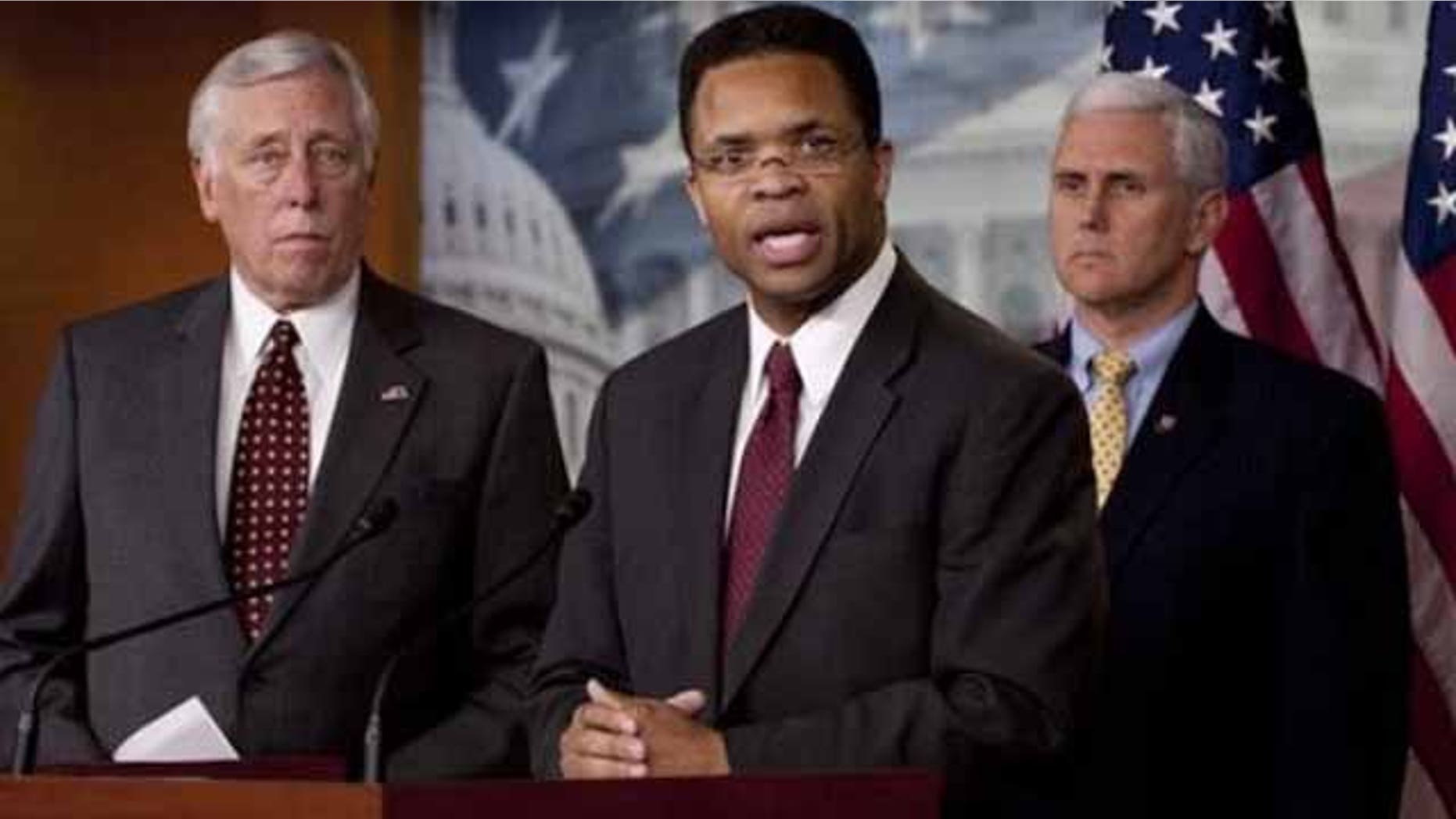 April 14: Rep. Jesse Jackson Jr., D-Ill., flanked by House Majority Leader Steny Hoyer of Md., left, and Rep. Mike Pence, R-Ind., addresses a news conference on Capitol Hill in Washington.