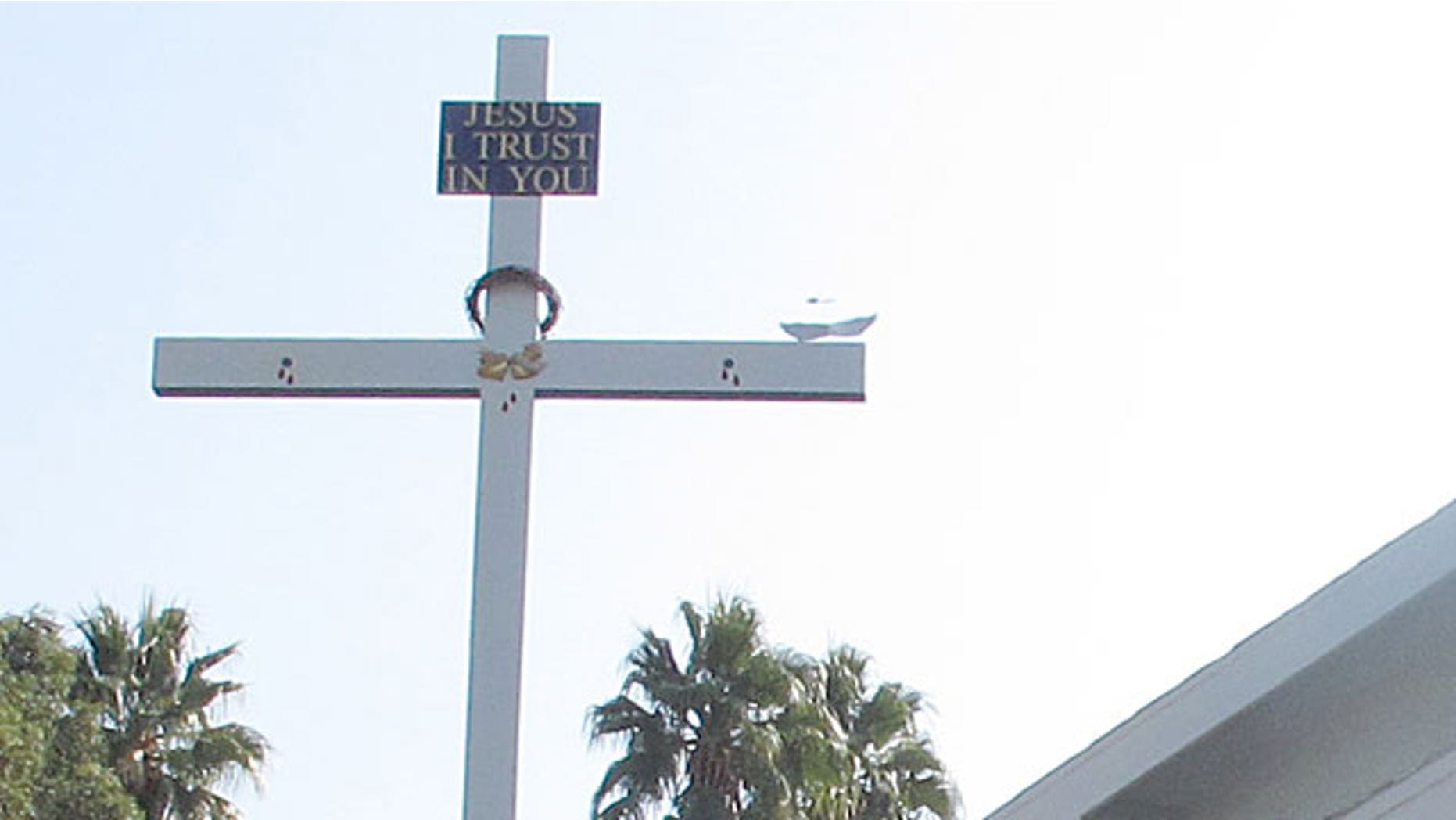 Homeowner Laly Dobener has erected a nearly 25 ft. cross on her front lawn, causing the concern of many of her neighbors on Hyannis Drive, in the West Hills section of Los Angeles. Neighbors' complaints have prompted city building inspectors to take a look at the cross. They're expected to determine this week whether it complies with zoning rules or should be removed.