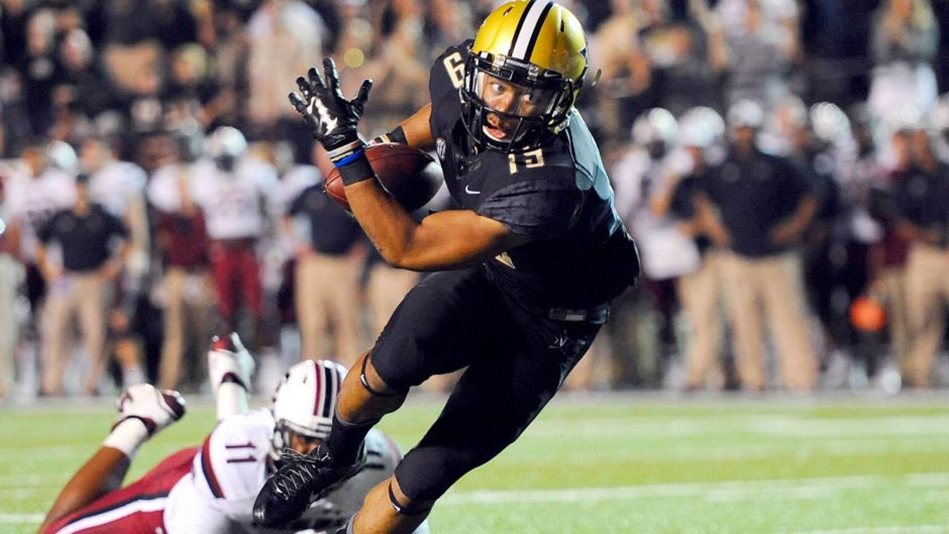 Sep 20, 2014; Nashville, TN, USA; Vanderbilt Commodores receiver C.J. Duncan (19) scores on an eight yard touchdown reception during the first half against the South Carolina Gamecocks at Vanderbilt Stadium. Mandatory Credit: Christopher Hanewinckel-USA TODAY Sports