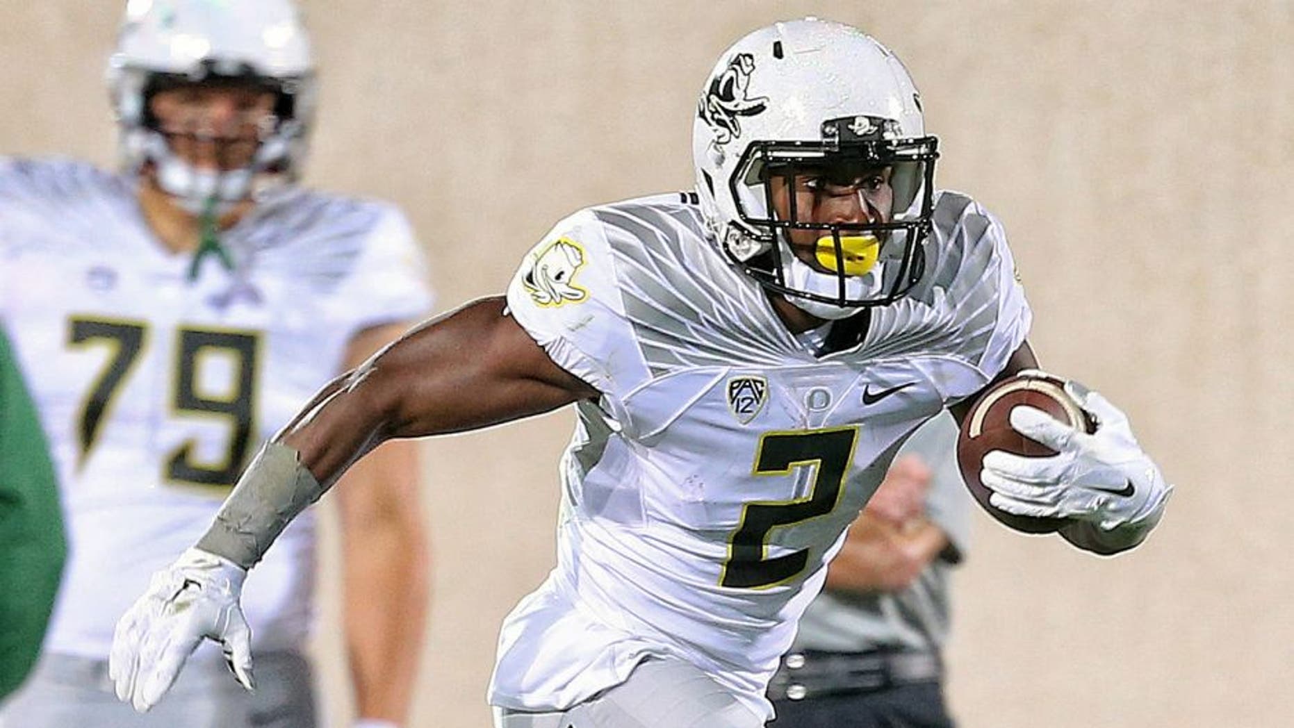 Sep 12, 2015; East Lansing, MI, USA; Oregon Ducks wide receiver Bralon Addison (2) runs for yards after a catch against the Michigan State Spartans during the 1st half of a game at Spartan Stadium. Mandatory Credit: Mike Carter-USA TODAY Sports