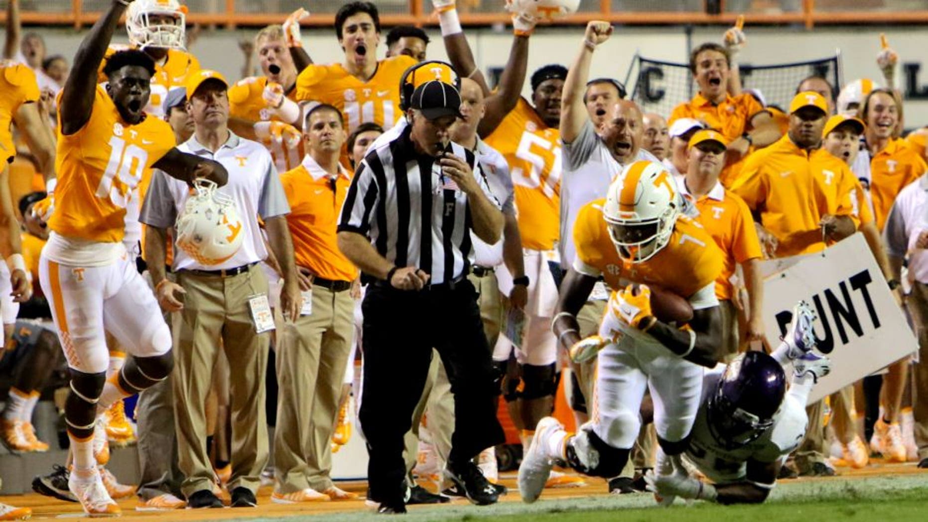 Sep 19, 2015; Knoxville, TN, USA; Tennessee Volunteers wide receiver Preston Williams (7) catches a pass against Western Carolina Catamounts defensive back Trey Morgan (26) during the second half at Neyland Stadium. Tennessee won 55 to10. Mandatory Credit: Randy Sartin-USA TODAY Sports