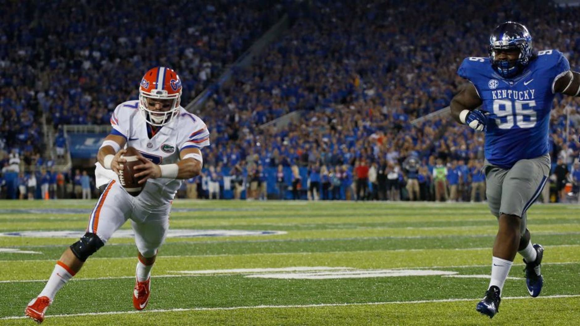 Sep 19, 2015; Lexington, KY, USA; Florida Gators quarterback Will Grier (7) runs for a touchdown against the Kentucky Wildcats in the first quarter at Commonwealth Stadium. Mandatory Credit: Mark Zerof-USA TODAY Sports