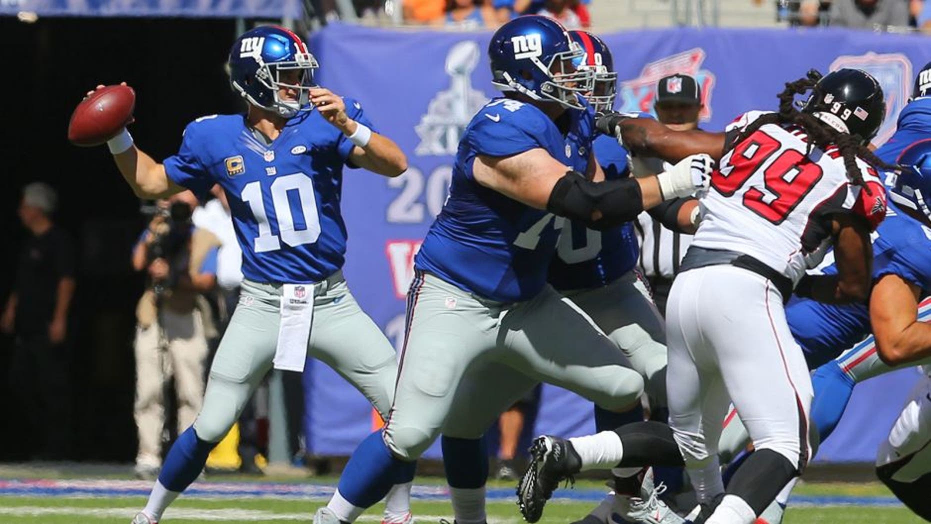 Sep 20, 2015; East Rutherford, NJ, USA; New York Giants quarterback Eli Manning (10) throws a pass during the first half of their game against the Atlanta Falcons at MetLife Stadium. Mandatory Credit: Ed Mulholland-USA TODAY Sports