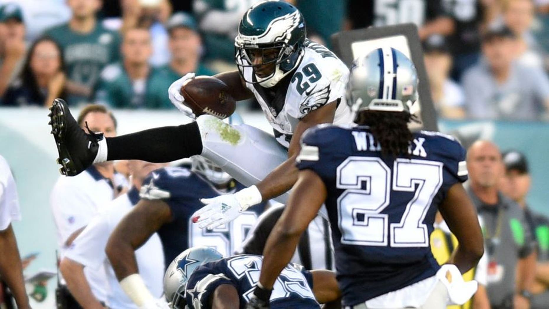Sep 20, 2015; Philadelphia, PA, USA; Philadelphia Eagles running back DeMarco Murray (29) hurdles over Dallas Cowboys cornerback Brandon Carr (39) in the third quarter at Lincoln Financial Field. Dallas defeated Philadelphia 20-10. Mandatory Credit: James Lang-USA TODAY Sports