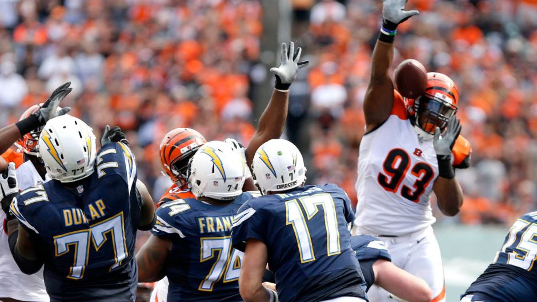 Sep 20, 2015; Cincinnati, OH, USA; Cincinnati Bengals defensive end Will Clarke (93) knocks down a pass from San Diego Chargers quarterback Philip Rivers (17) in the second half at Paul Brown Stadium. The Bengals won 24-19. Mandatory Credit: Aaron Doster-USA TODAY Sports