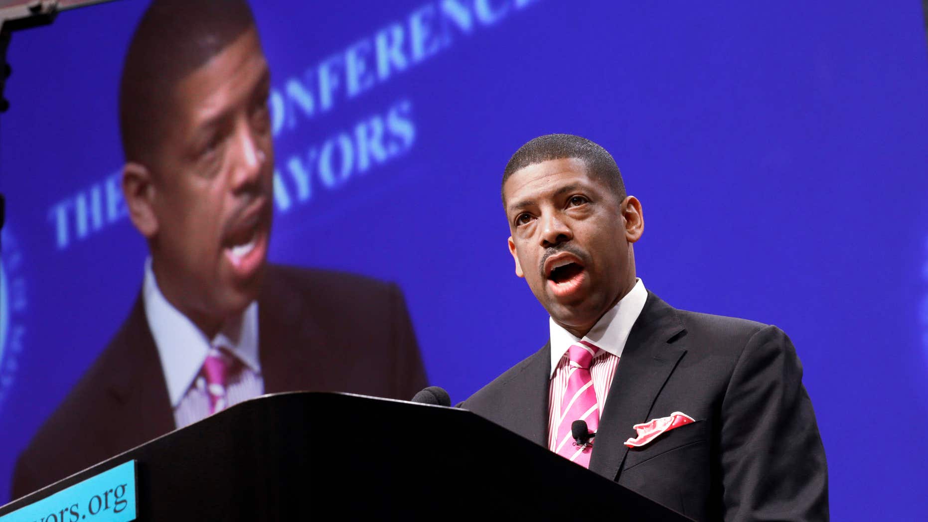 FILE -In this June 23, 2014 file photo, Sacramento, Calif., Mayor Kevin Johnson, president of the U.S. Conference of Mayors, speaks before a panel discussion about sports and race relations during a conference meeting in Dallas.
