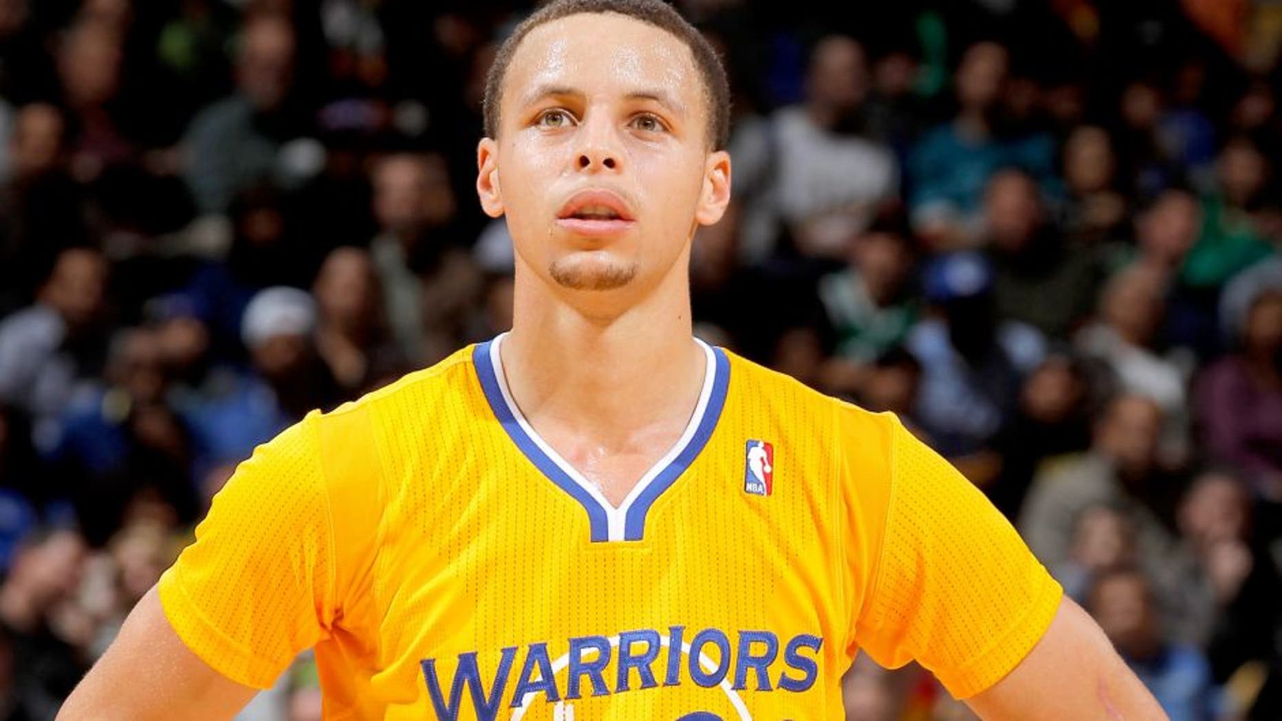 OAKLAND, CA - FEBRUARY 22: Stephen Curry #30 of the Golden State Warriors in a game against the San Antonio Spurs on February 22, 2013 at Oracle Arena in Oakland, California. NOTE TO USER: User expressly acknowledges and agrees that, by downloading and or using this photograph, user is consenting to the terms and conditions of Getty Images License Agreement. Mandatory Copyright Notice: Copyright 2013 NBAE (Photo by Rocky Widner/NBAE via Getty Images)