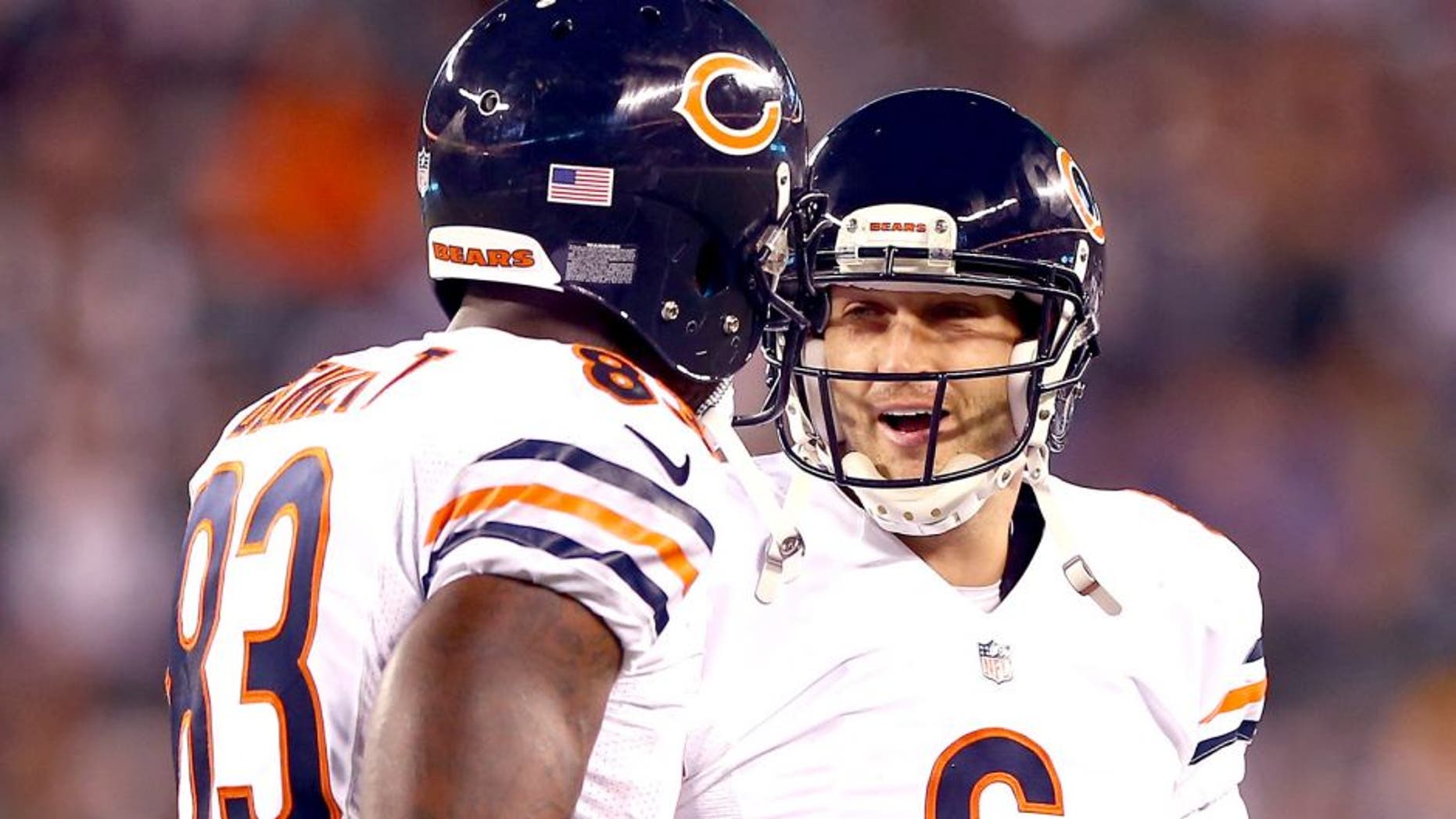EAST RUTHERFORD, NJ - SEPTEMBER 22: Quarterback Jay Cutler #6 celebrates a touchdown with tight end Martellus Bennett #83 of the Chicago Bears against the New York Jets during a game at MetLife Stadium on September 22, 2014 in East Rutherford, New Jersey. (Photo by Elsa/Getty Images)