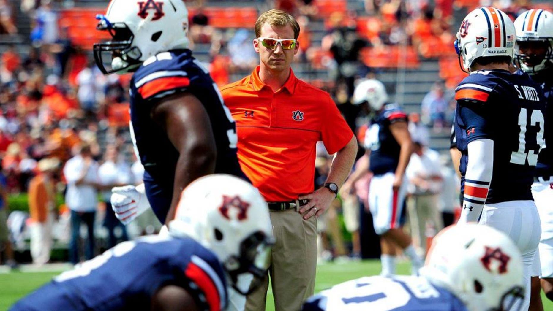 Aug 30, 2014; Auburn, AL, USA; Auburn Tigers offensive coordinator Rhett Lashlee during warm-ups prior to the game against the Arkansas Razorbacks at Jordan Hare Stadium. Mandatory Credit: Shanna Lockwood-USA TODAY Sports