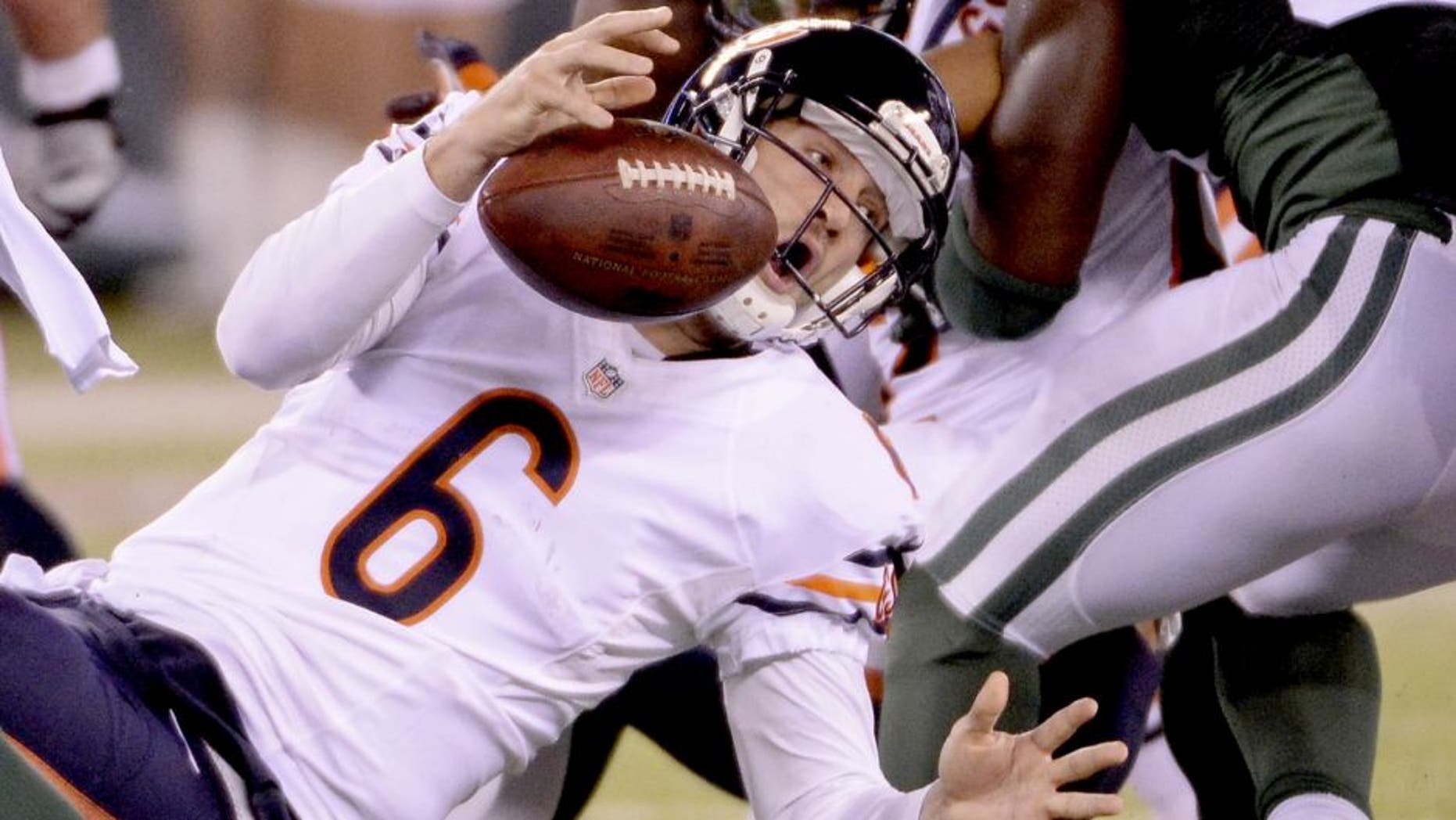 Sep 22, 2014; East Rutherford, NJ, USA; Chicago Bears quarterback Jay Cutler (6) fumbles the ball during the first half against the New York Jets at MetLife Stadium. Mandatory Credit: Robert Deutsch-USA TODAY Sports