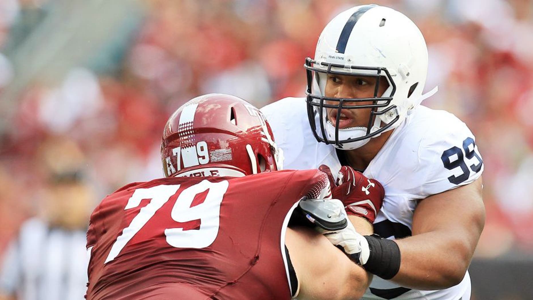 Sep 5, 2015; Philadelphia, PA, USA; Penn State Nittany Lions defensive tackle Austin Johnson (99) tries to break past Temple Owls offensive linesmen Kyle Friend (79) during the second quarter at Lincoln Financial Field. Temple defeated Penn State 27-10. Mandatory Credit: Matthew O'Haren-USA TODAY Sports