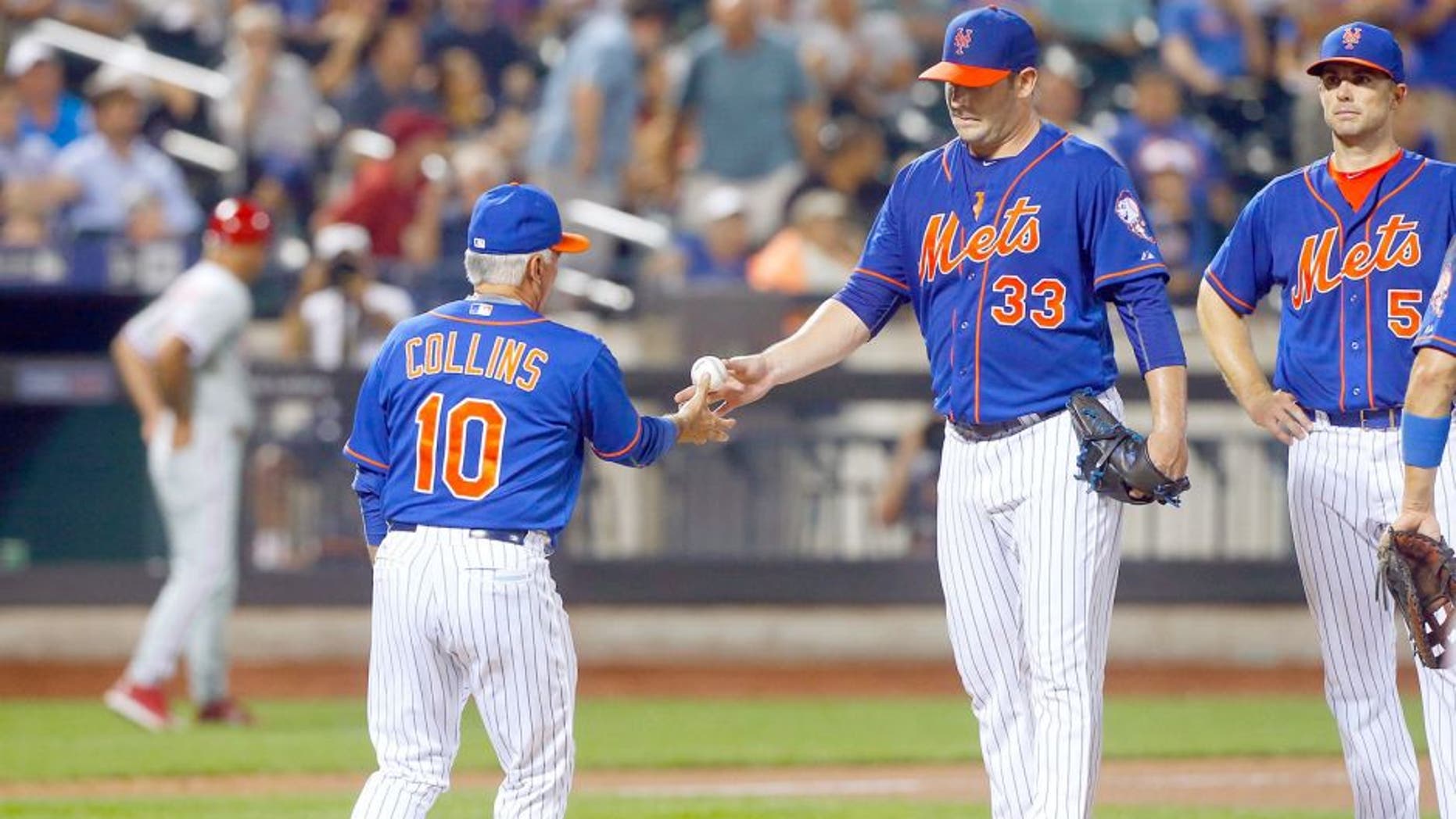 NEW YORK, NY - SEPTEMBER 02: Matt Harvey #33 of the New York Mets hands the ball to manager Terry Collins #10 against the Philadelphia Phillies at Citi Field on September 2, 2015 in the Flushing neighborhood of the Queens borough of New York City. The Mets defeated the Phillies 9-4. (Photo by Jim McIsaac/Getty Images)