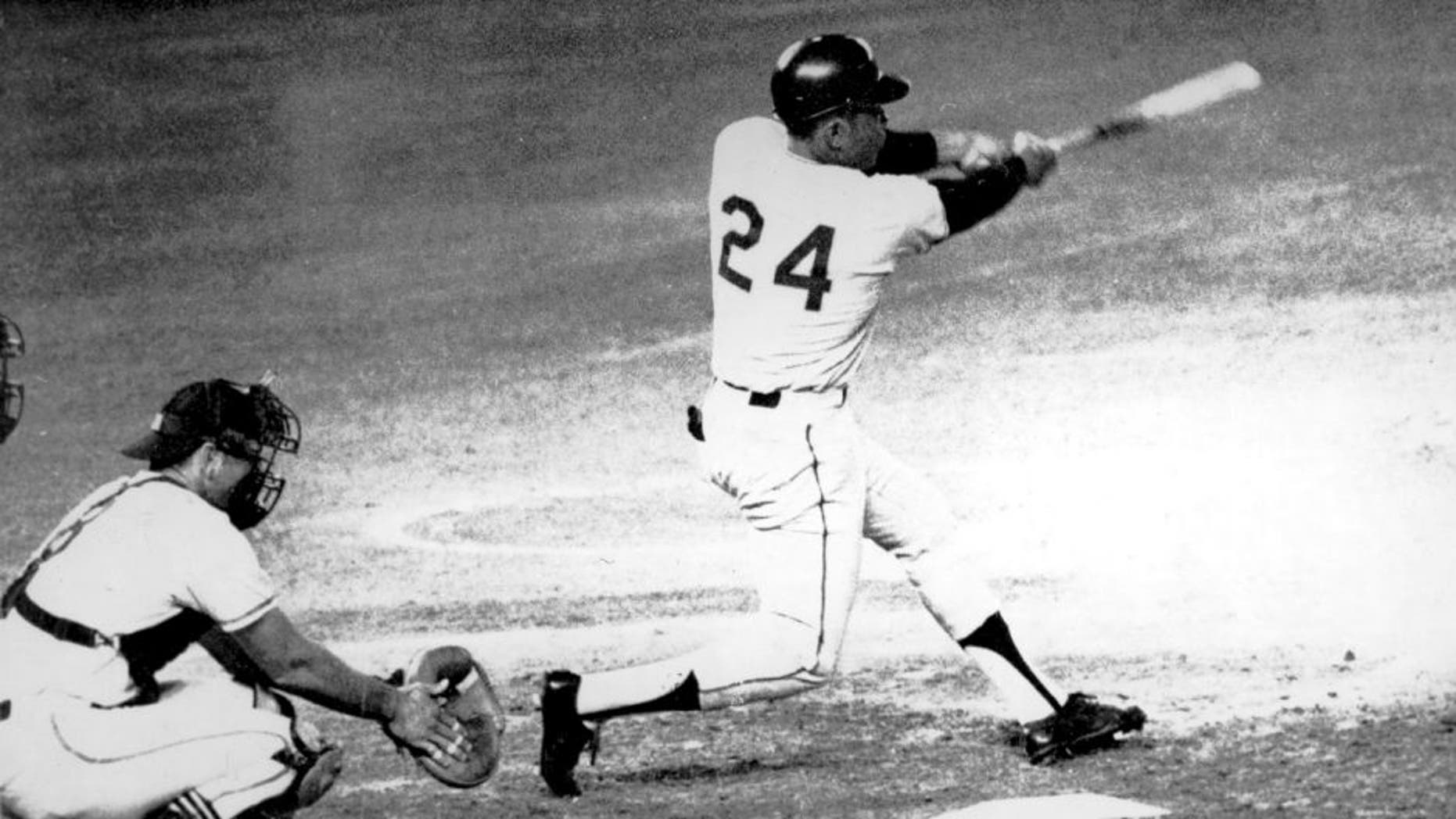 American baseball player Willie Mays (#24, right) of the San Francisco Giants hits the ball that become his 600th career home run during a game against the San Diego Padres at the Jack Murphy Stadium (later Qualcomm Stadium), San Diego, California, September 22, 1969. Padres's catcher Chris Cannizzaro (#8) is at left. (Photo by Bruce Bennett Studios/Getty Images)