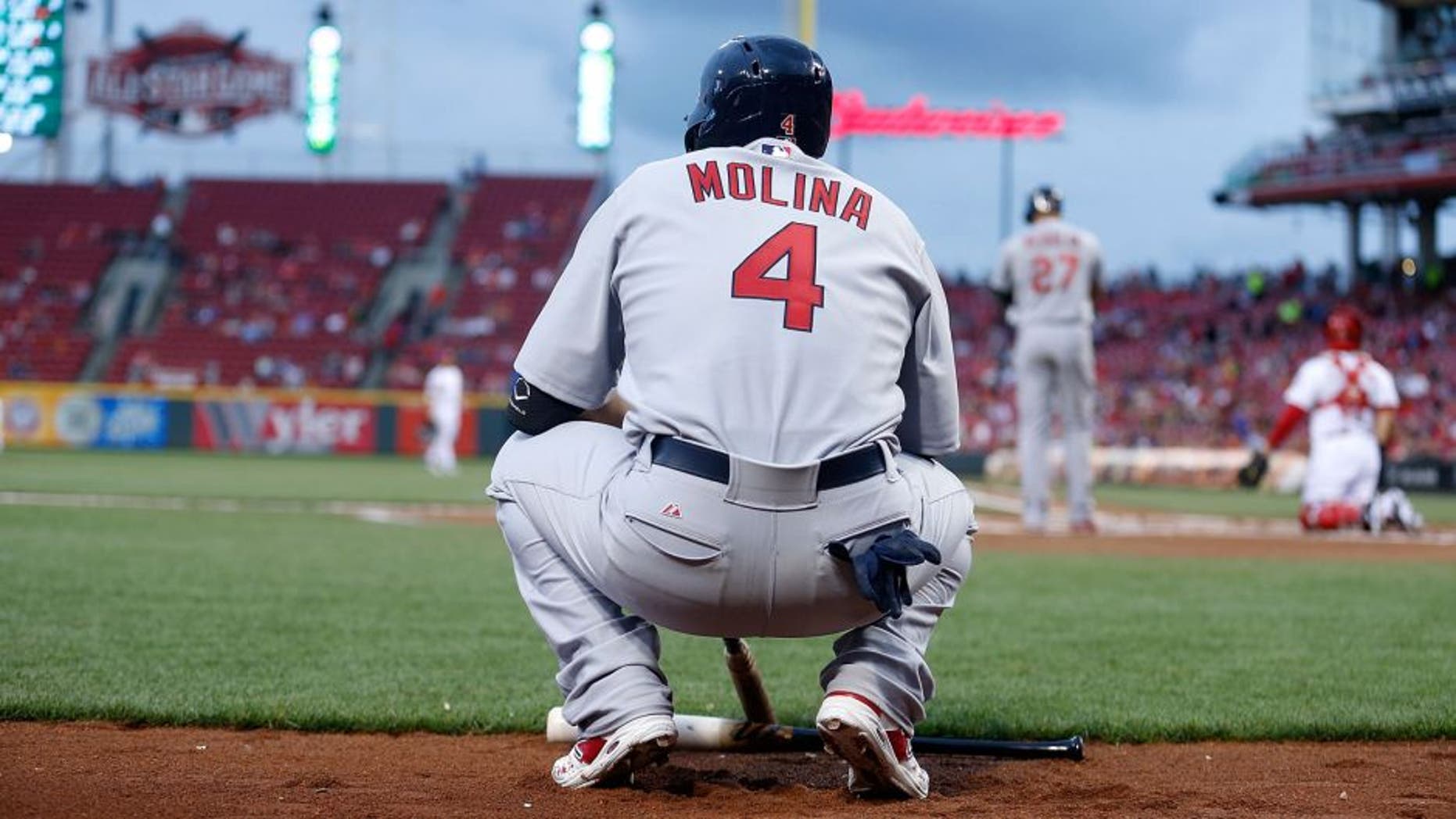 CINCINNATI, OH - SEPTEMBER 11: Yadier Molina #4 of the St. Louis Cardinals waits for his chance to bat during the game against the Cincinnati Reds at Great American Ball Park on September 11, 2015 in Cincinnati, Ohio. (Photo by Kirk Irwin/Getty Images)
