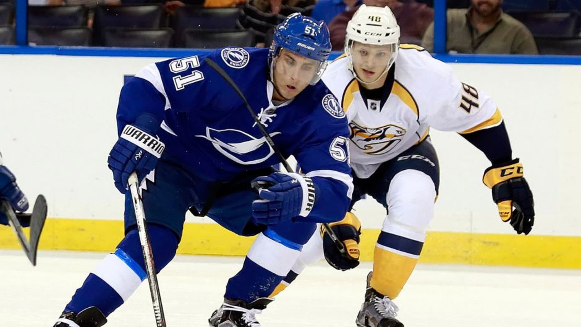 Sep 22, 2015; Tampa, FL, USA; Tampa Bay Lightning center Valtteri Filppula (51) skates with the puck as Nashville Predators defenseman Kristian Nakyva (48) defends during the second period at Amalie Arena. Mandatory Credit: Kim Klement-USA TODAY Sports