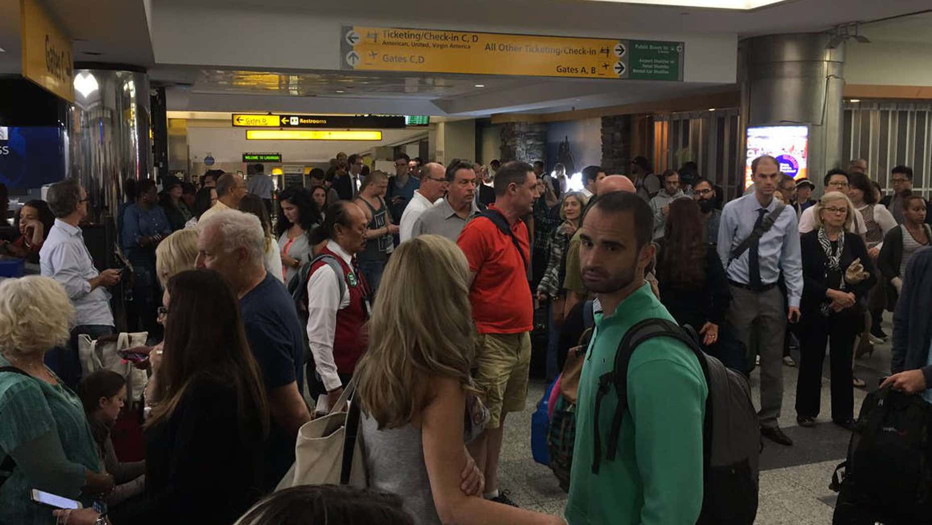 Sept. 22, 2016: Passengers evacuate LaGuardia Airport terminal B.
