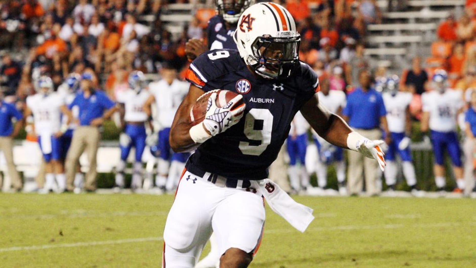 Sep 6, 2014; Auburn, AL, USA; Auburn Tigers running back Roc Thomas (9) carries against the San Jose State Spartans during the second half at Jordan Hare Stadium. The Tigers beat the Spartans 59-13. Mandatory Credit: John Reed-USA TODAY Sports
