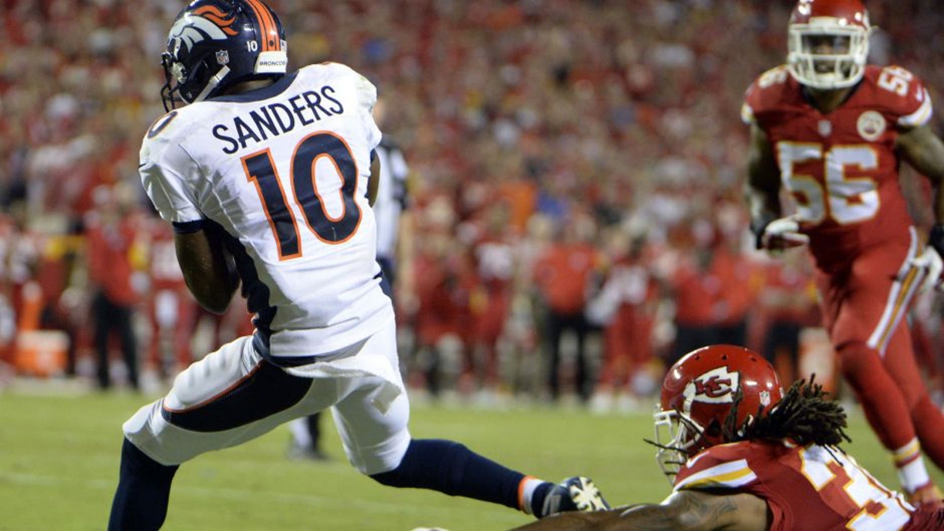 Sep 17, 2015; Kansas City, MO, USA; Denver Broncos wide receiver Emmanuel Sanders (10) catches a touchdown against the Kansas City Chiefs in the second half at Arrowhead Stadium. Denver won the game 31-24. Mandatory Credit: John Rieger-USA TODAY Sports