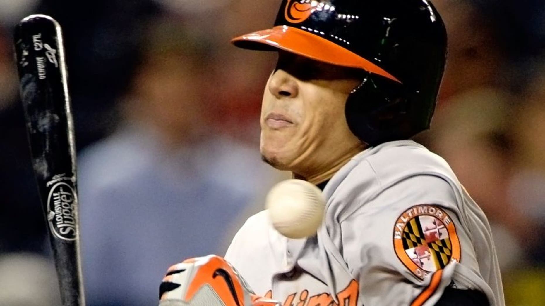 Sep 23, 2015; Washington, DC, USA; Baltimore Orioles third baseman Manny Machado (13) get hit by a Washington Nationals relief pitcher Jonathan Papelbon (not pictured) pitch during the ninth inning at Nationals Park. Baltimore Orioles defeated Washington Nationals 4-3. Mandatory Credit: Tommy Gilligan-USA TODAY Sports