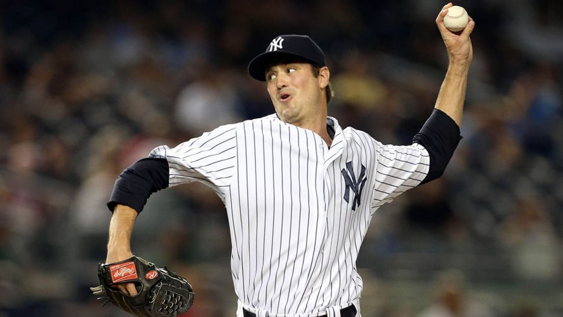 Aug 17, 2015; Bronx, NY, USA; New York Yankees relief pitcher Andrew Miller (48) pitches against the Minnesota Twins during the tenth inning at Yankee Stadium. The Yankees defeated the Twins 8 - 7. Mandatory Credit: Adam Hunger-USA TODAY Sports