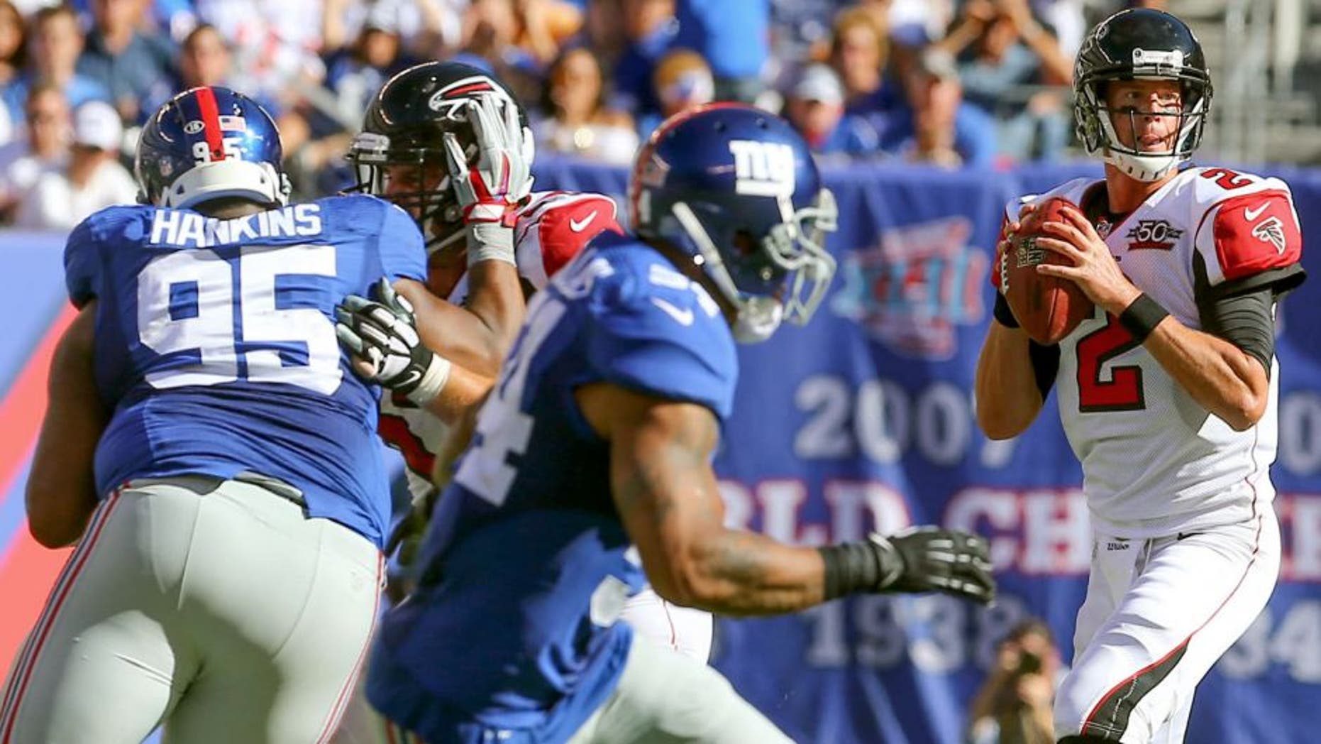 Sep 20, 2015; East Rutherford, NJ, USA; Atlanta Falcons quarterback Matt Ryan (2) looks to pass the ball while being rushed by New York Giants defensive tackle Johnathan Hankins (95) during the second half at MetLife Stadium. The Falcons defeated the Giants 24-20. Mandatory Credit: Ed Mulholland-USA TODAY Sports