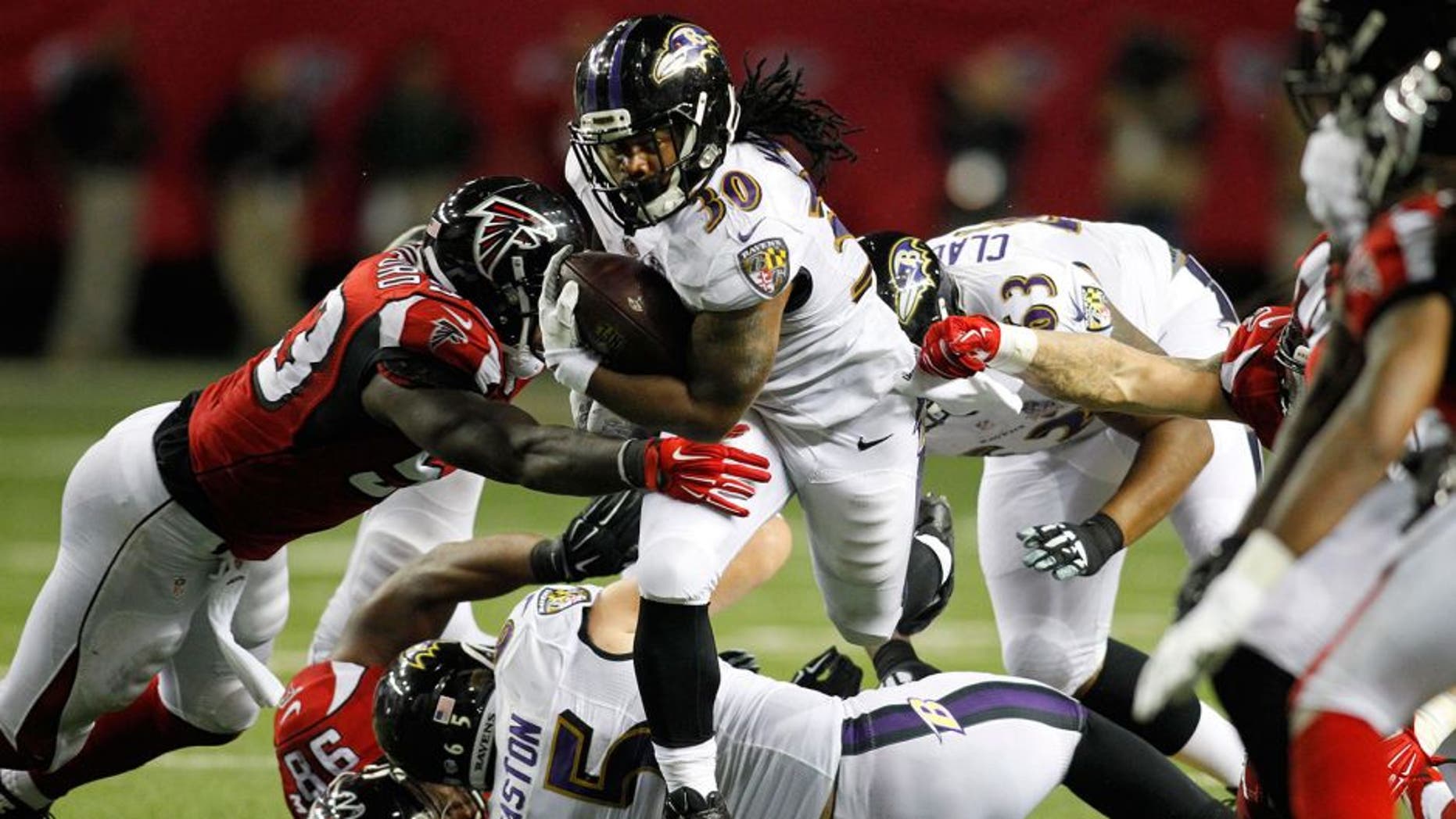 Sep 3, 2015; Atlanta, GA, USA; Baltimore Ravens running back Terrence Magee (30) runs the ball against the Atlanta Falcons in the fourth quarter at the Georgia Dome. The Ravens defeated the Falcons 20-19. Mandatory Credit: Brett Davis-USA TODAY Sports