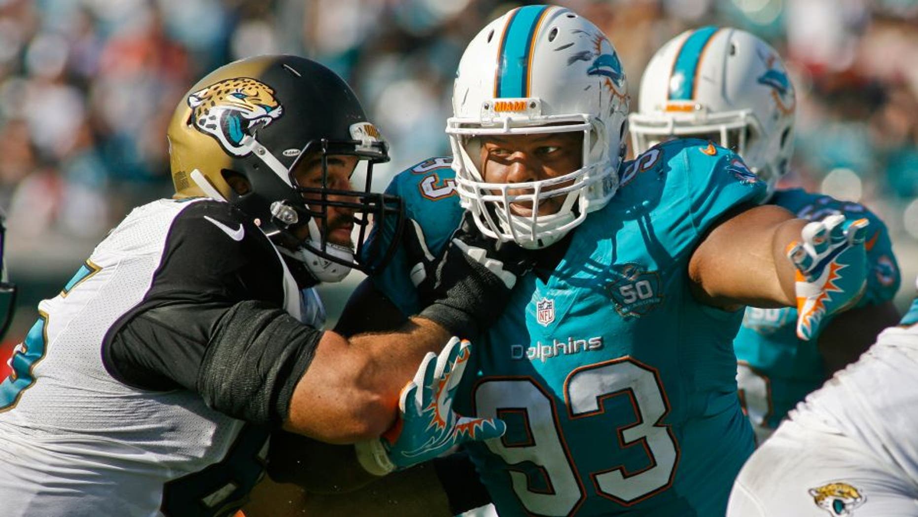 Sep 20, 2015; Jacksonville, FL, USA; Jacksonville Jaguars guard Brandon Linder (65) blocks Miami Dolphins defensive tackle Ndamukong Suh (93) in the second quarter at EverBank Field. Mandatory Credit: Phil Sears-USA TODAY Sports