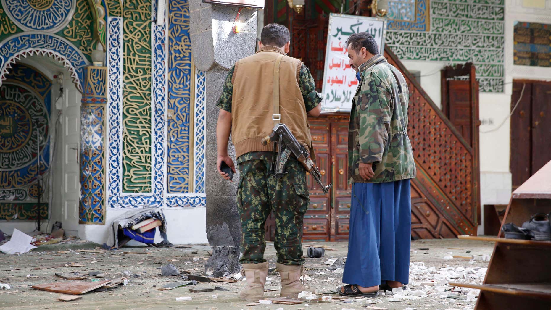 Sept. 24, 2015: Shiite fighters, known as Houthis inspect the inside of the al-Balili mosque after two suicide bombings at the mosque during Eid al-Adha prayers in Sanaa, Yemen.