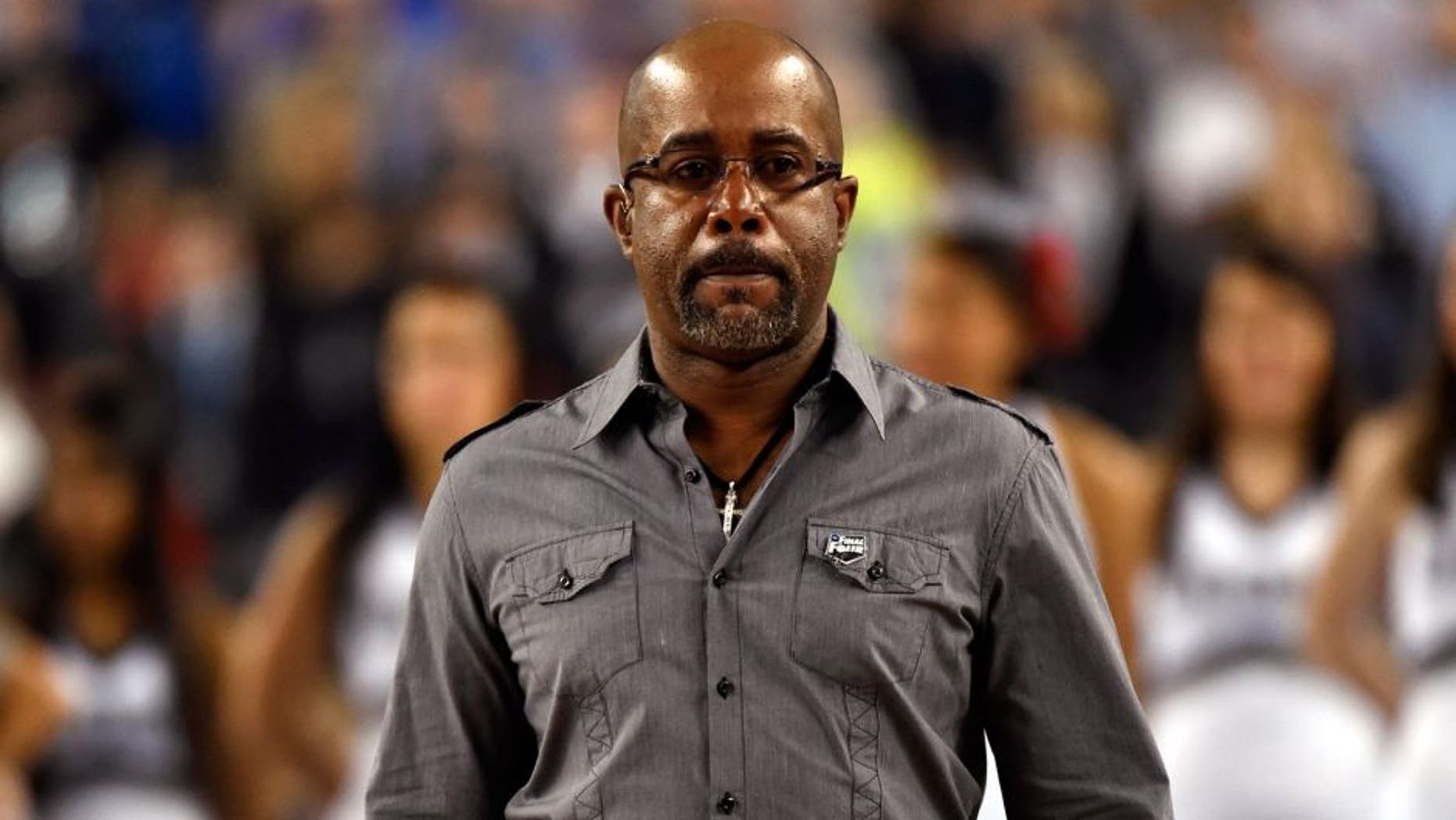 Apr 7, 2014; Arlington, TX, USA; Recording artist Darius Rucker comes out to sing the national anthem before the championship game of the Final Four in the 2014 NCAA Mens Division I Championship tournament between the Connecticut Huskies and Kentucky Wildcats at AT&T Stadium. Mandatory Credit: Robert Deutsch-USA TODAY Sports