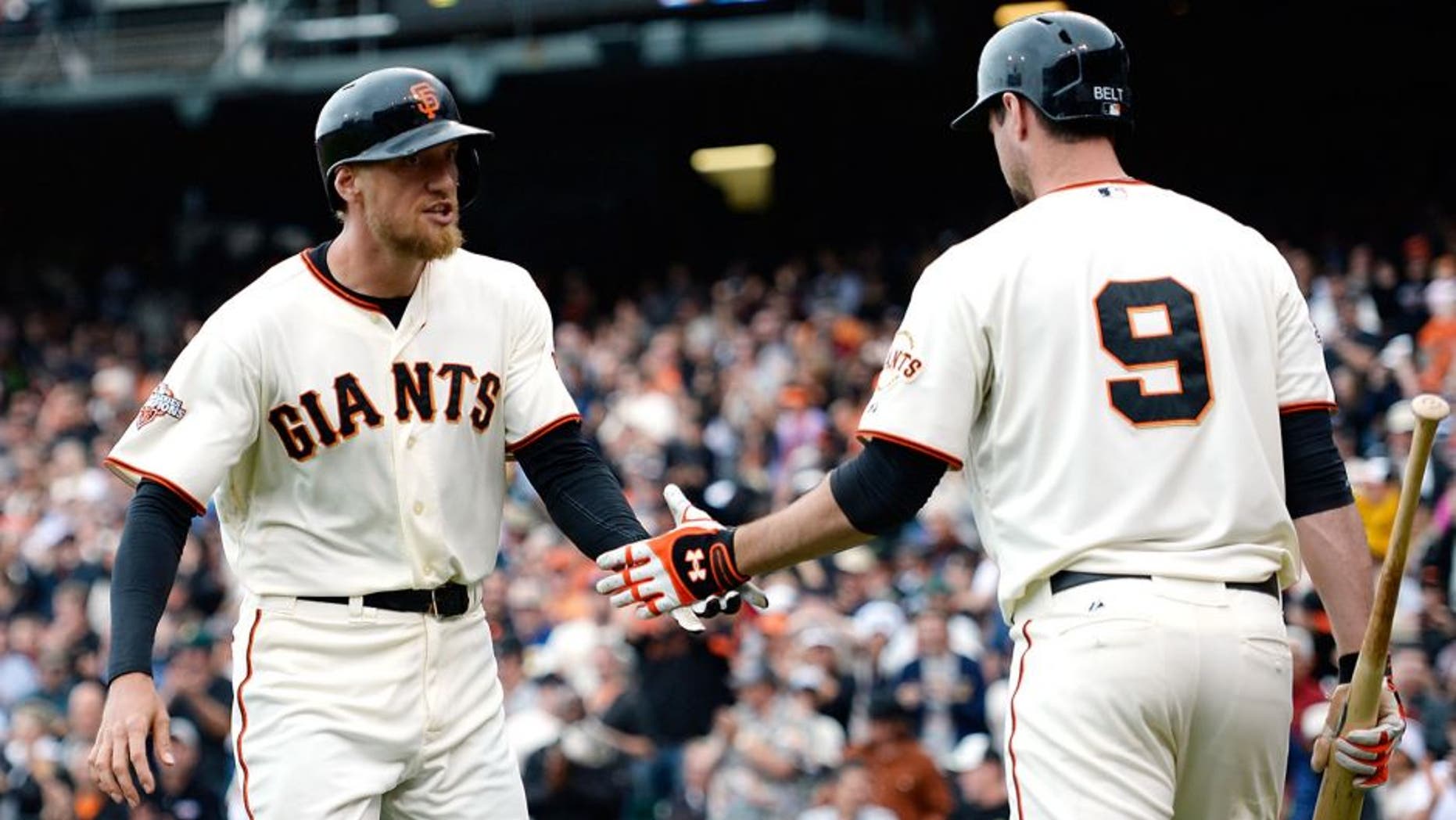 SAN FRANCISCO, CA - JUNE 23: Hunter Pence #8 of the San Francisco Giants is congratulated by Brandon Belt #9 after Pence hit a solo home run in the seventh inning against the Miami Marlins at AT&T Park on June 23, 2013 in San Francisco, California. (Photo by Thearon W. Henderson/Getty Images)