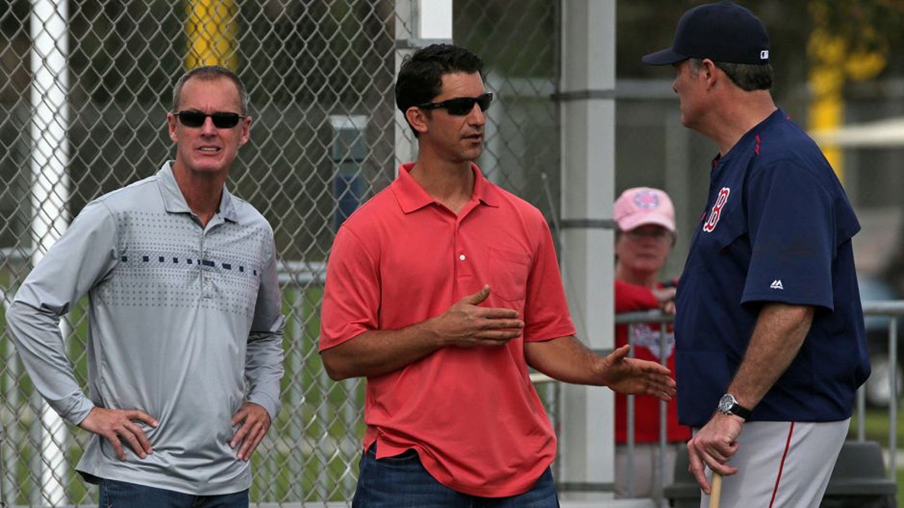 FORT MYERS, FL - FEBRUARY 23: Left to right: Allard Baird, Red Sox Vice President, Player Personnel, and Red Sox assistant general manager Mike Hazen talk with Boston Red Sox manager John Farrell. It was reported today that Cuban super prospect Yoan Moncada had agreed to sign with the team for a record $31.5 million signing bonus. (Photo by Barry Chin/The Boston Globe via Getty Images)
